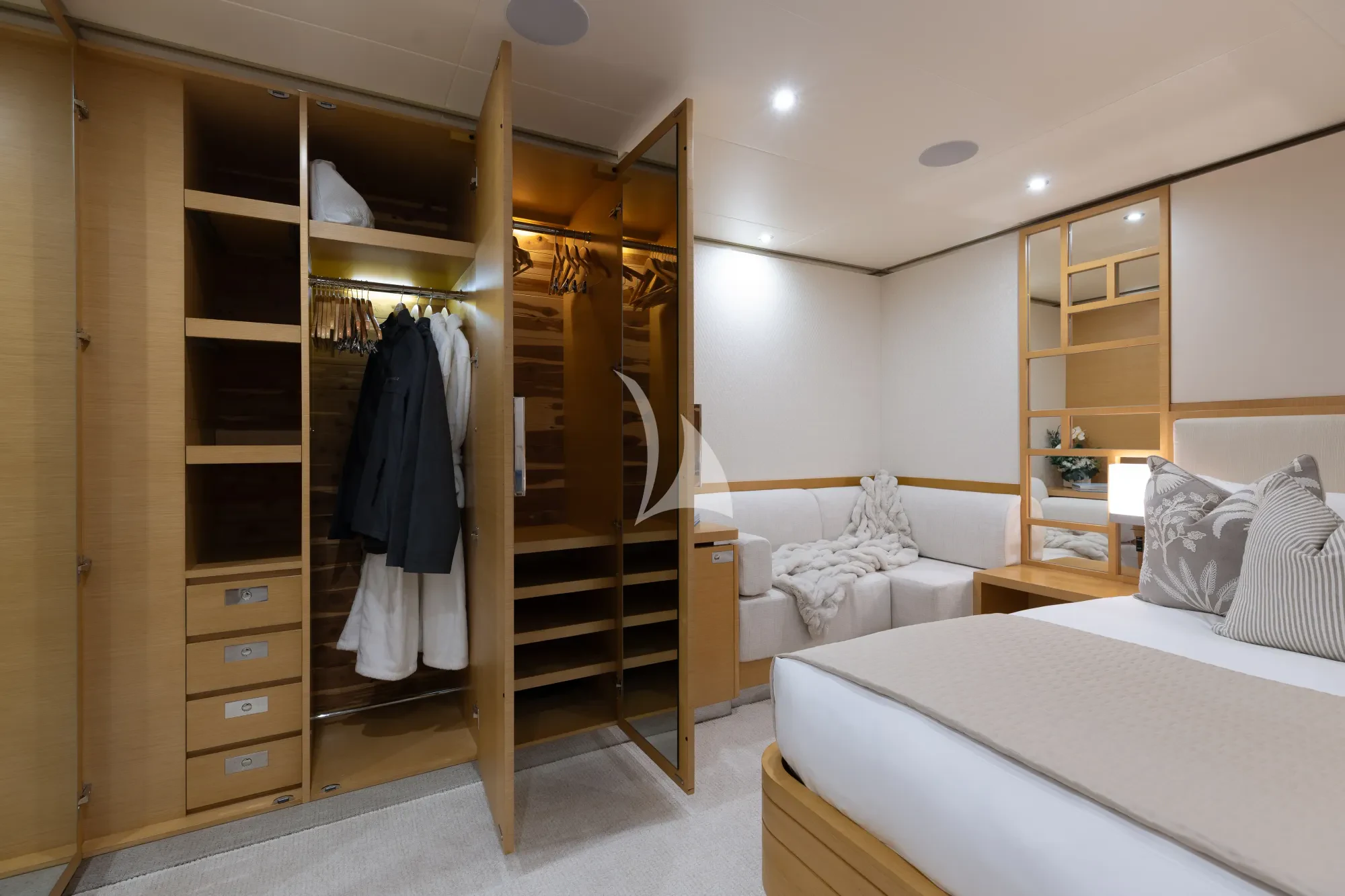 a bedroom with a closet and a bed aboard LIMITED RISKS Yacht for Charter