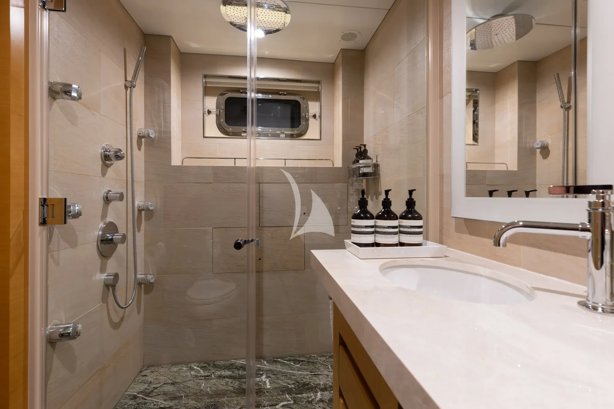 a bathroom with a bathtub and shower aboard LIMITED RISKS Yacht for Charter