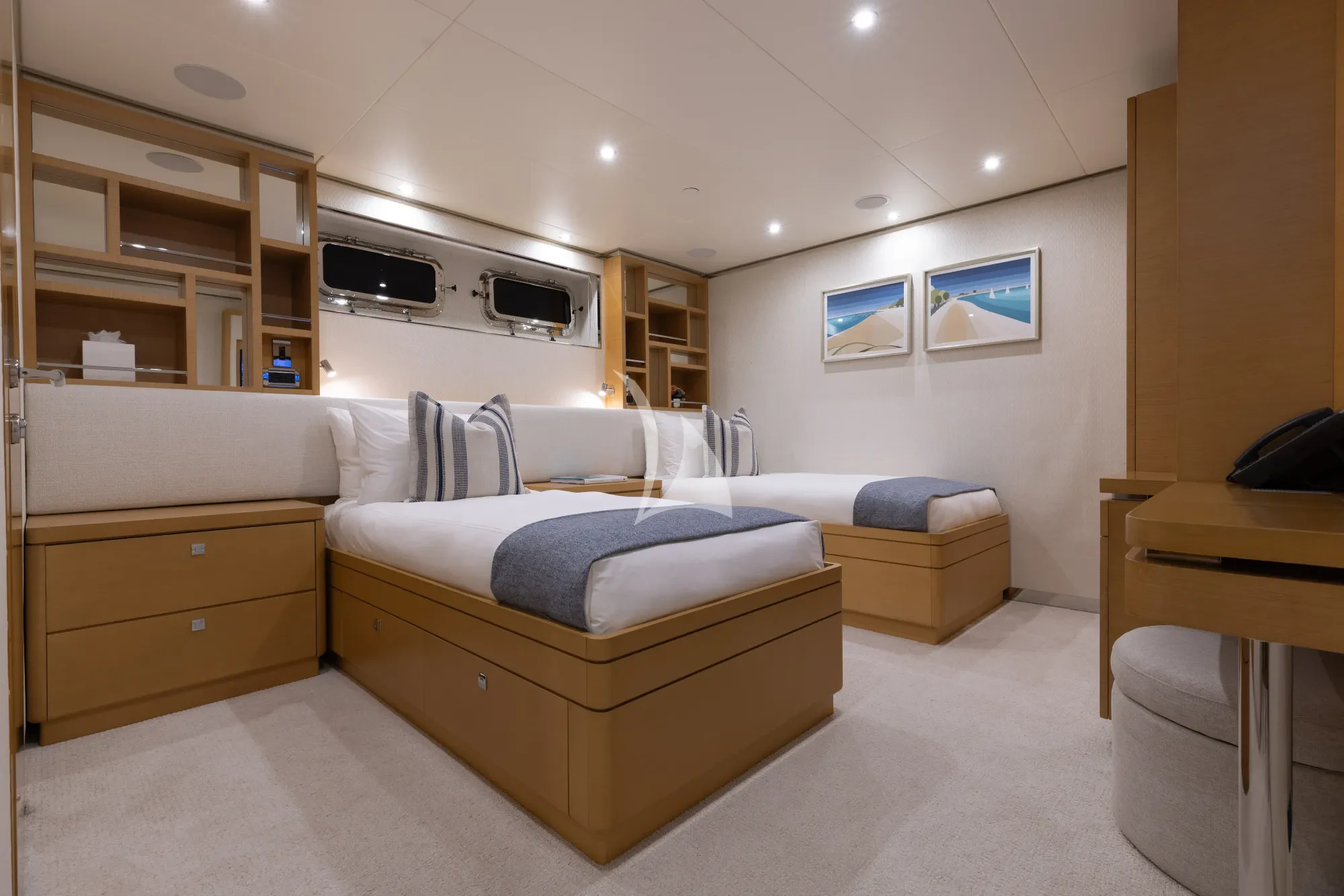 a bedroom with a bed and a tv aboard LIMITED RISKS Yacht for Charter