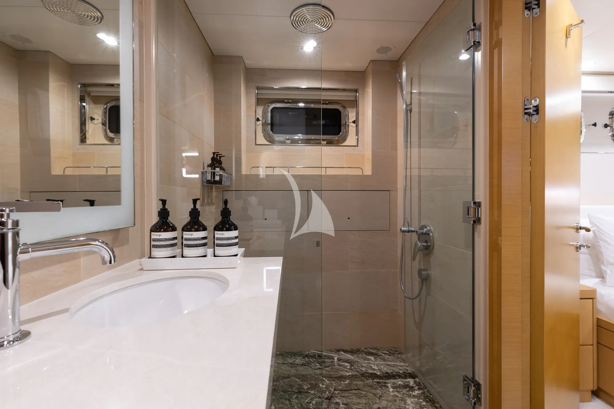 a bathroom with a glass shower aboard LIMITED RISKS Yacht for Charter
