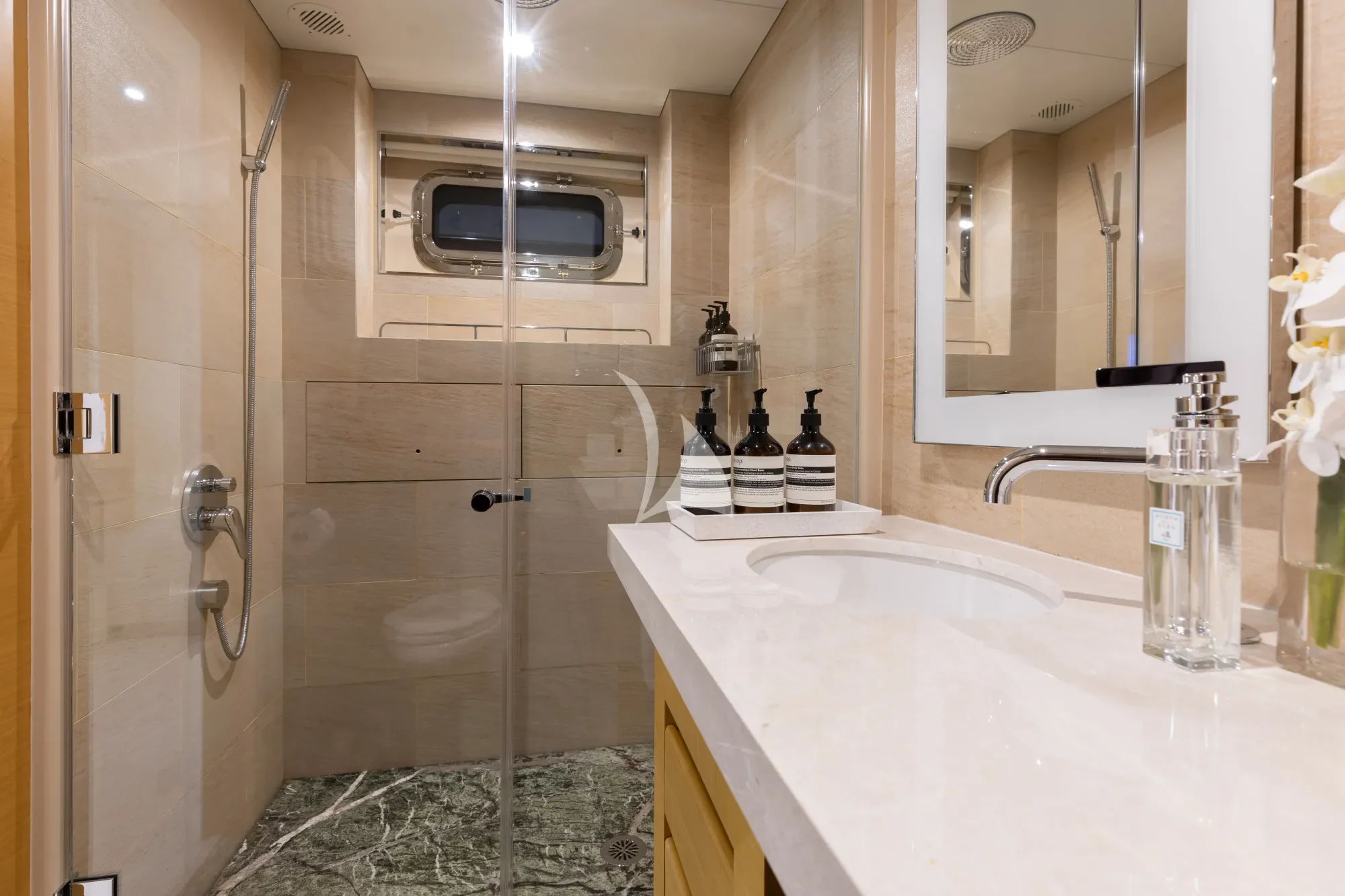 a bathroom with a glass shower aboard LIMITED RISKS Yacht for Charter