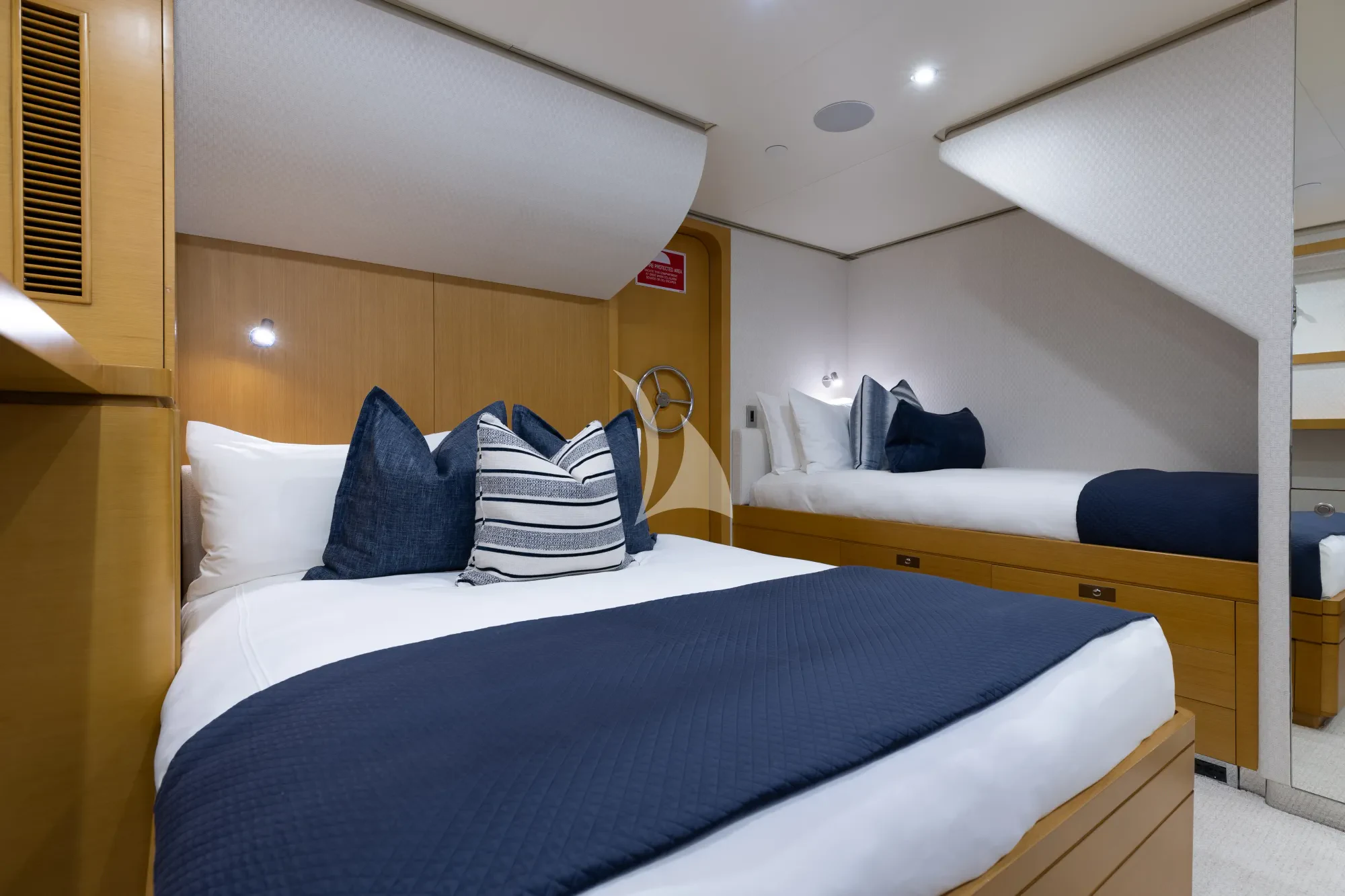 a room with two beds aboard LIMITED RISKS Yacht for Charter