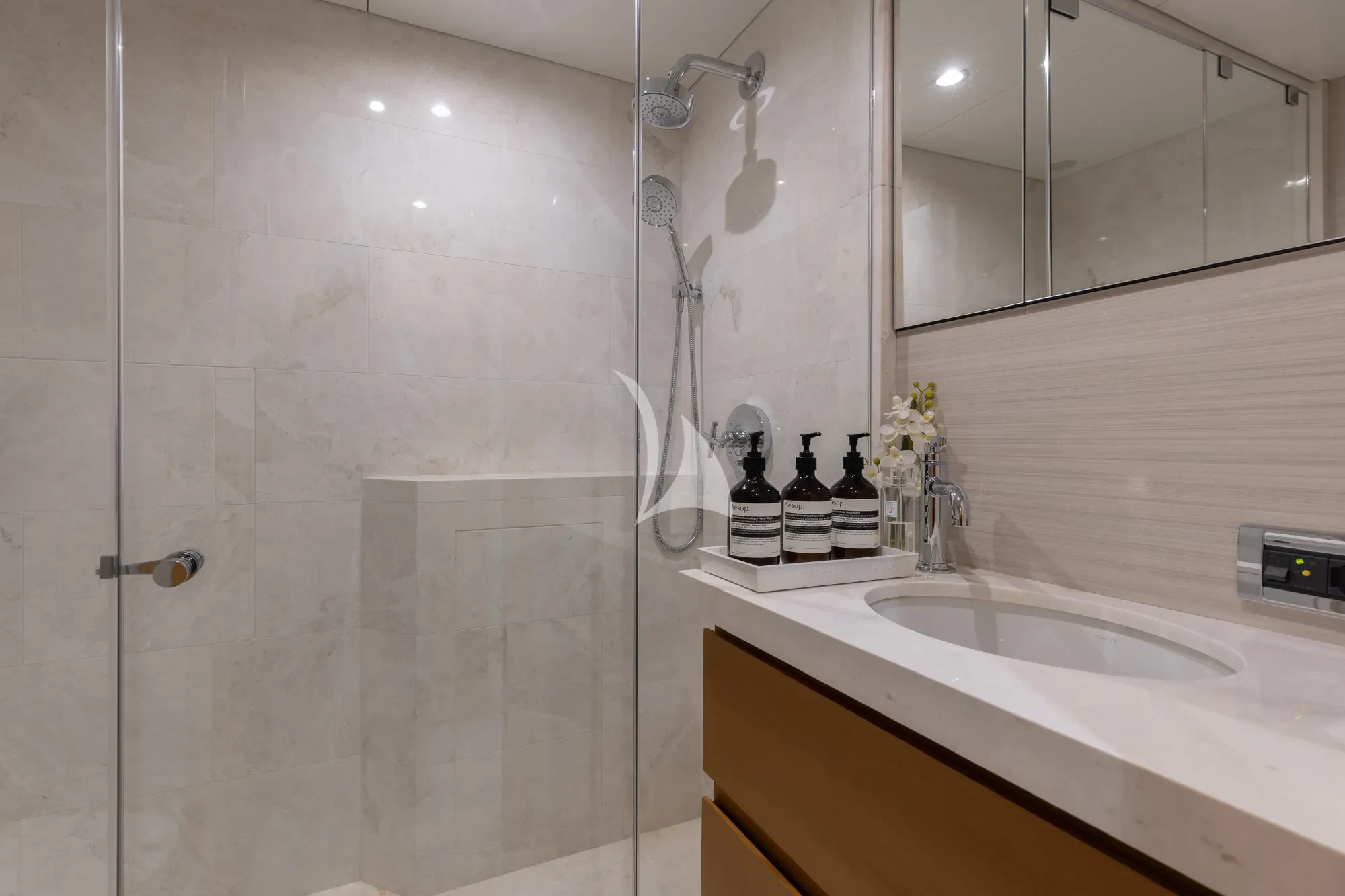 a bathroom with a shower and sink aboard LIMITED RISKS Yacht for Charter