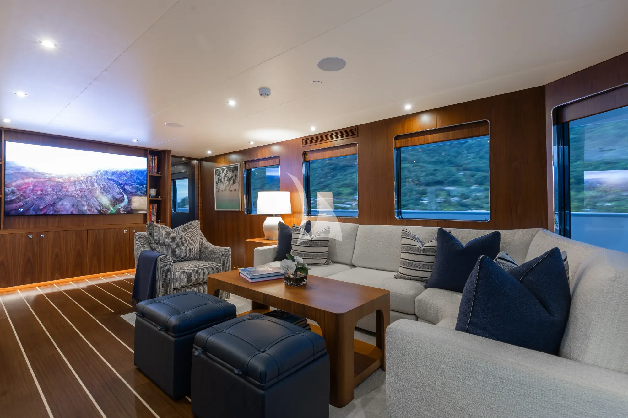 a living room with a couch and a table aboard LIMITED RISKS Yacht for Charter