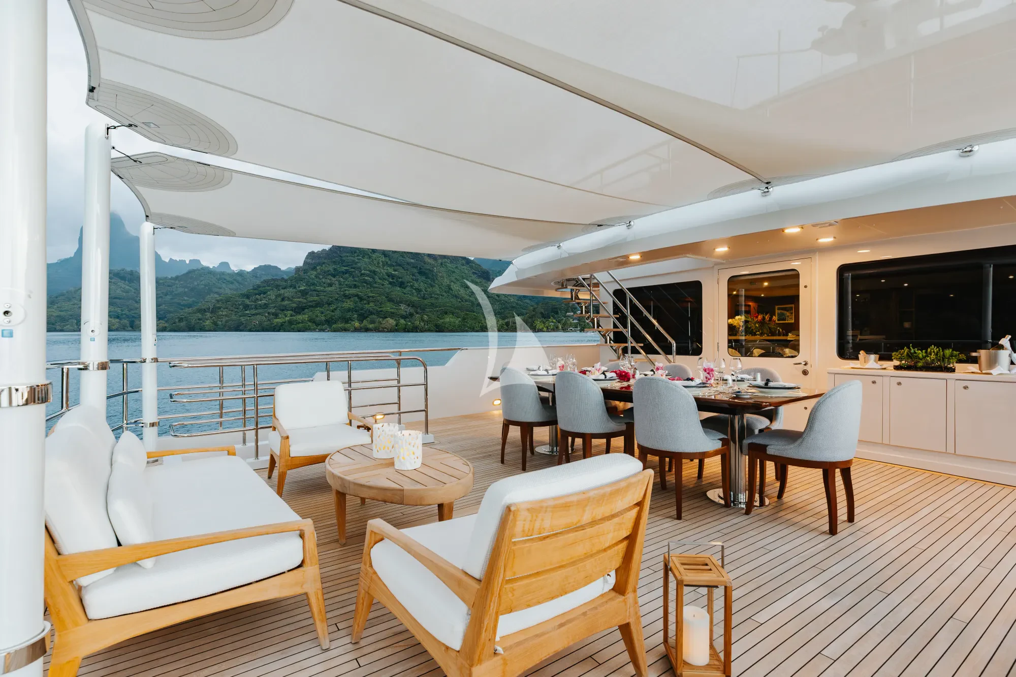 a room with a table chairs and a large window aboard LIMITED RISKS Yacht for Charter