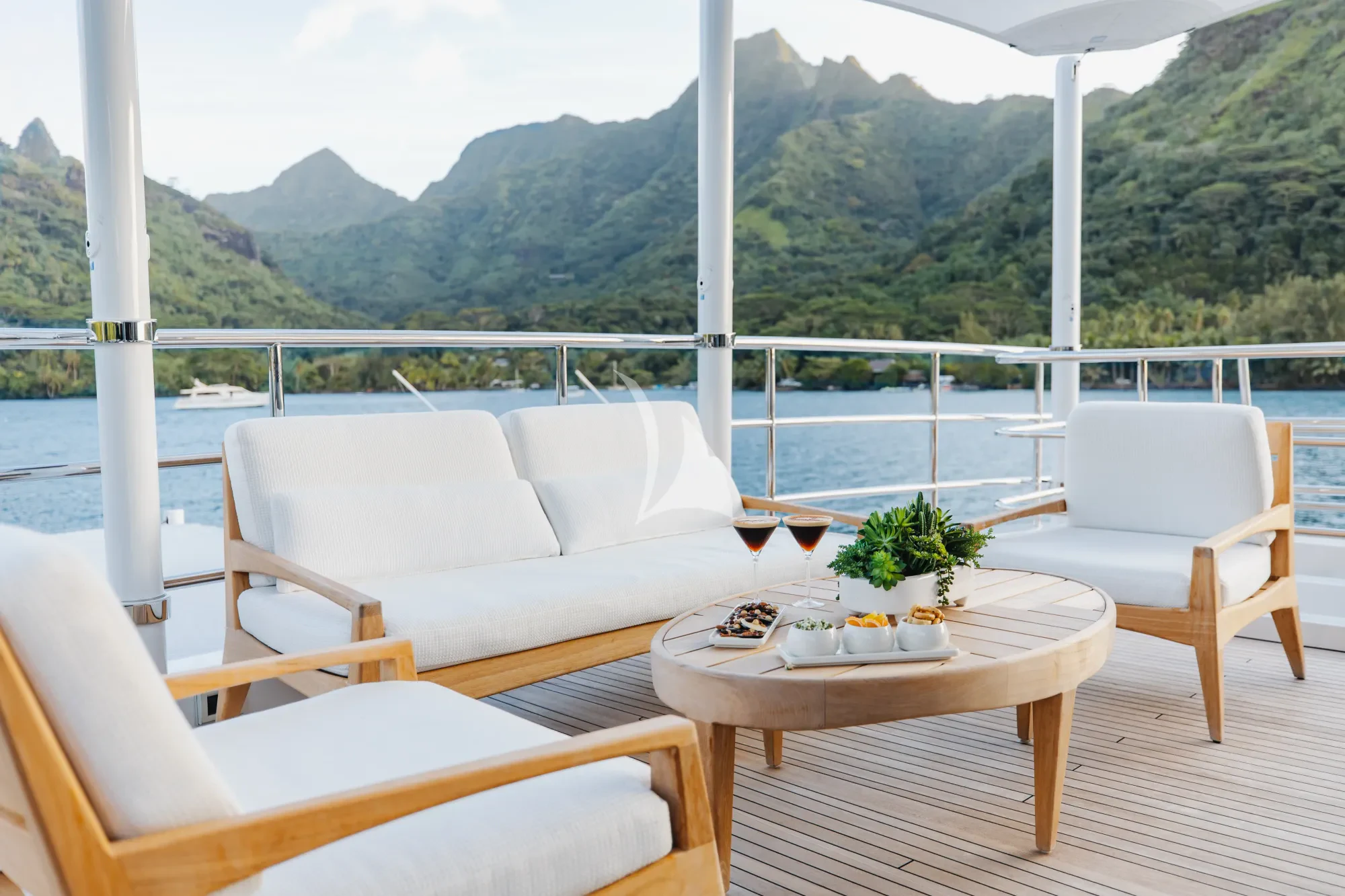 a table and chairs on a deck aboard LIMITED RISKS Yacht for Charter