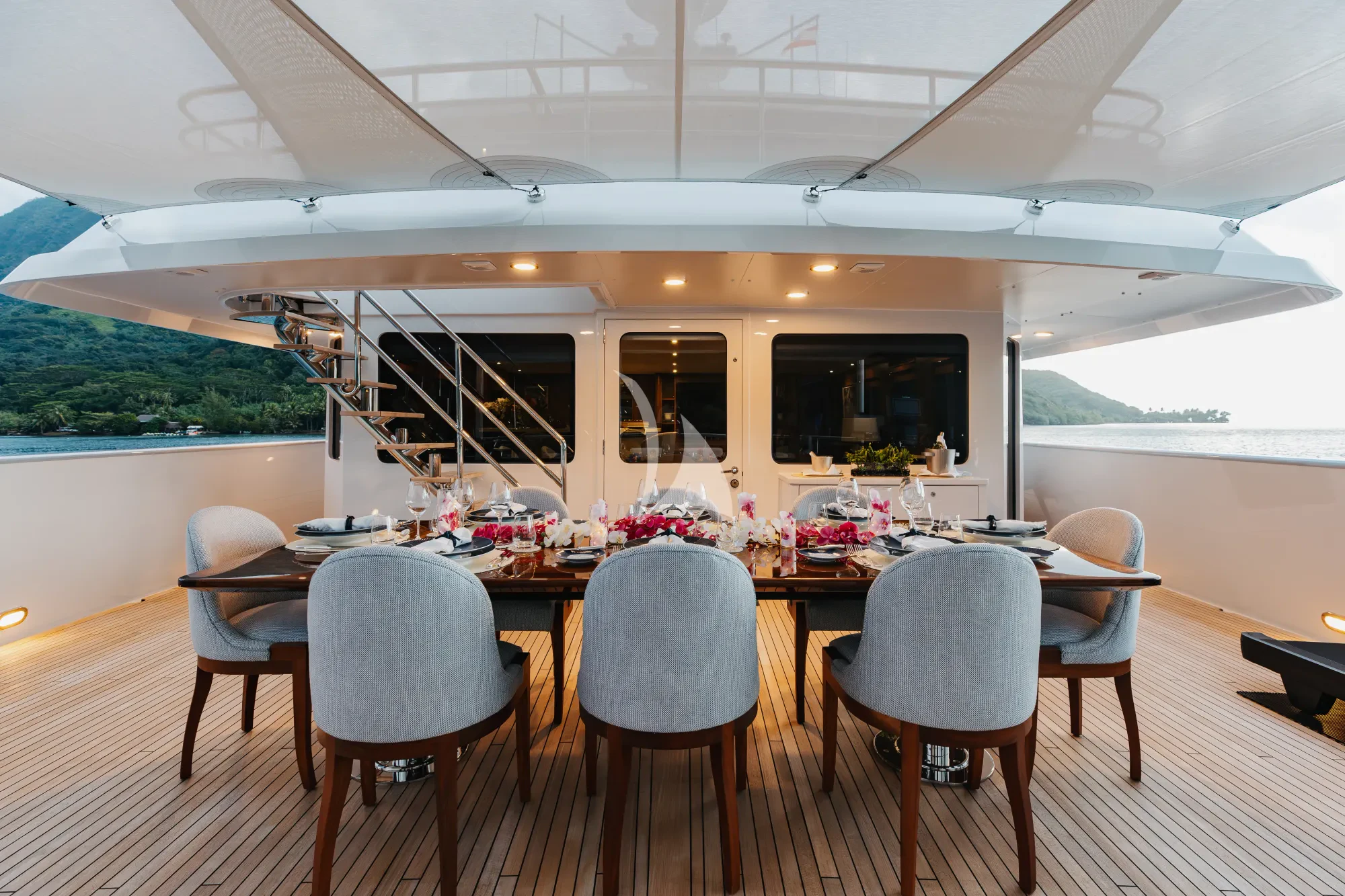 a table with chairs around it aboard LIMITED RISKS Yacht for Charter