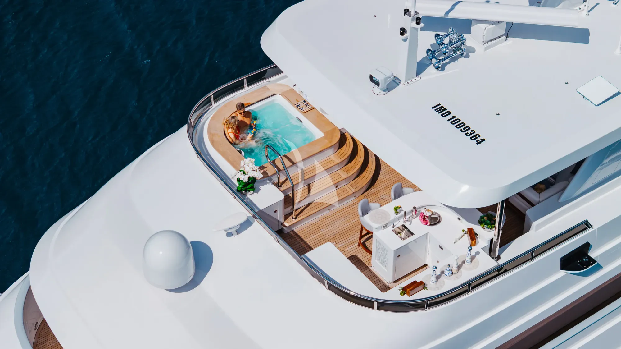 a white boat on a body of water aboard LIMITED RISKS Yacht for Charter