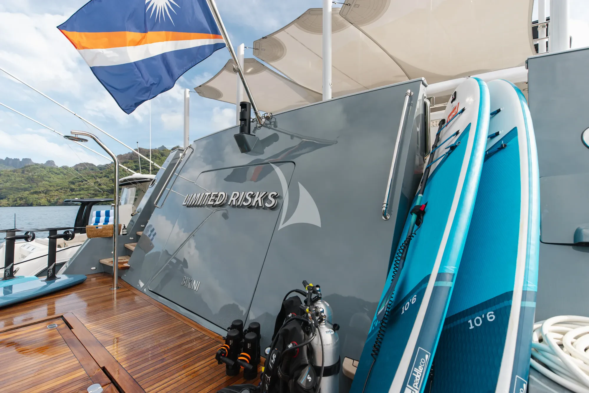 a boat with a blue cover aboard LIMITED RISKS Yacht for Charter