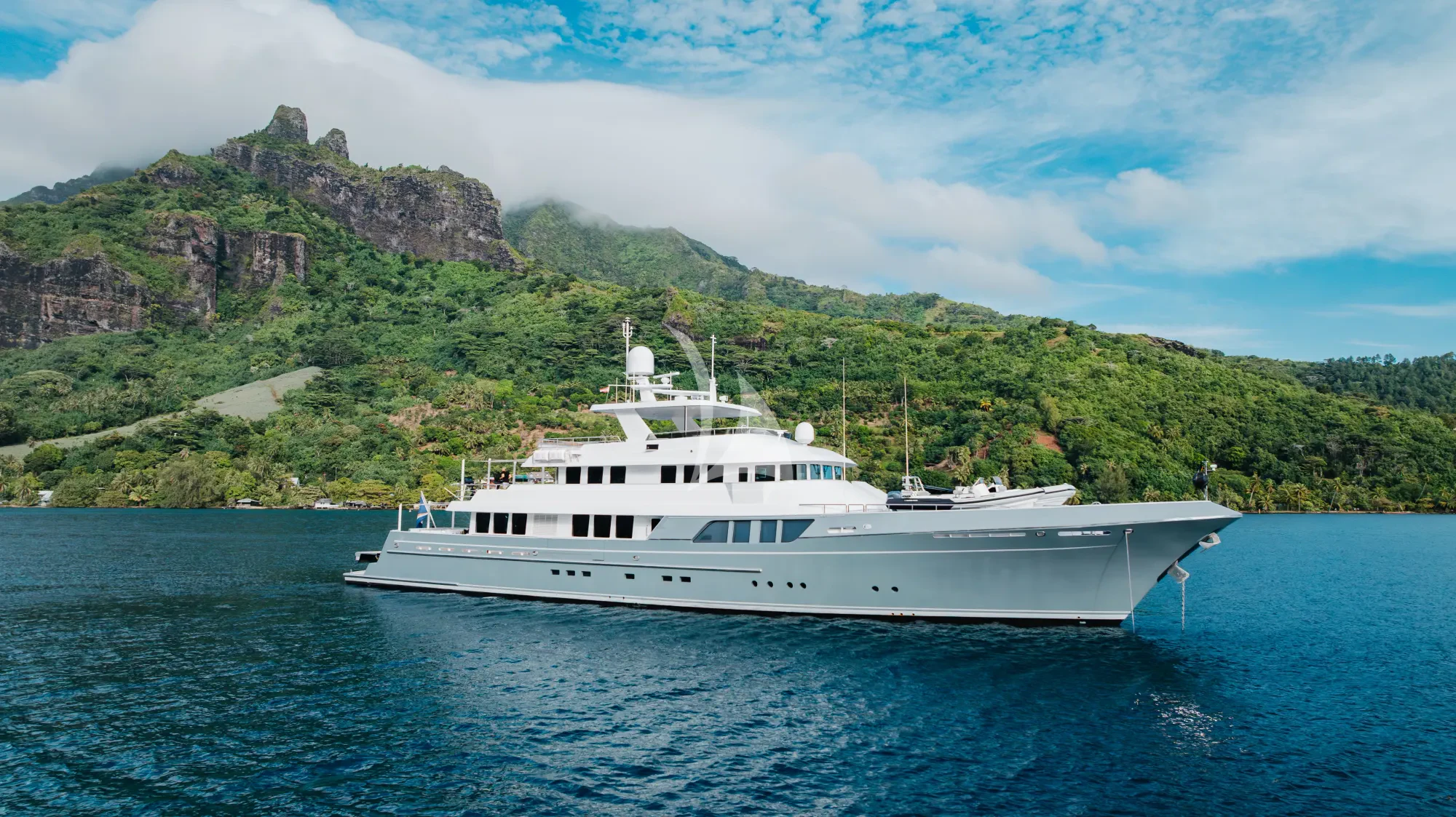 a white boat on the water aboard LIMITED RISKS Yacht for Charter