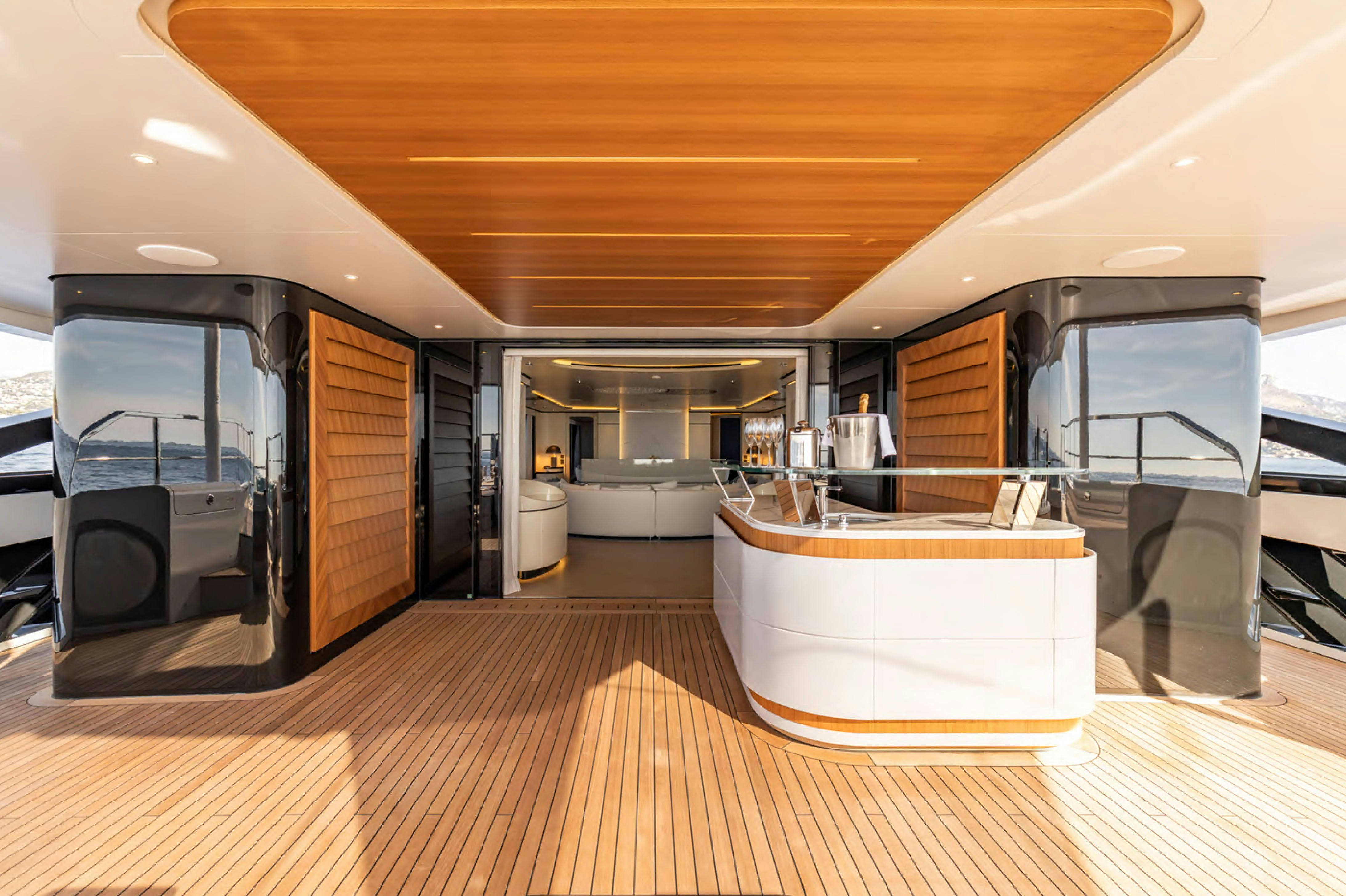 a large room with a wood floor and a large white tub aboard FELICITA Yacht for Charter