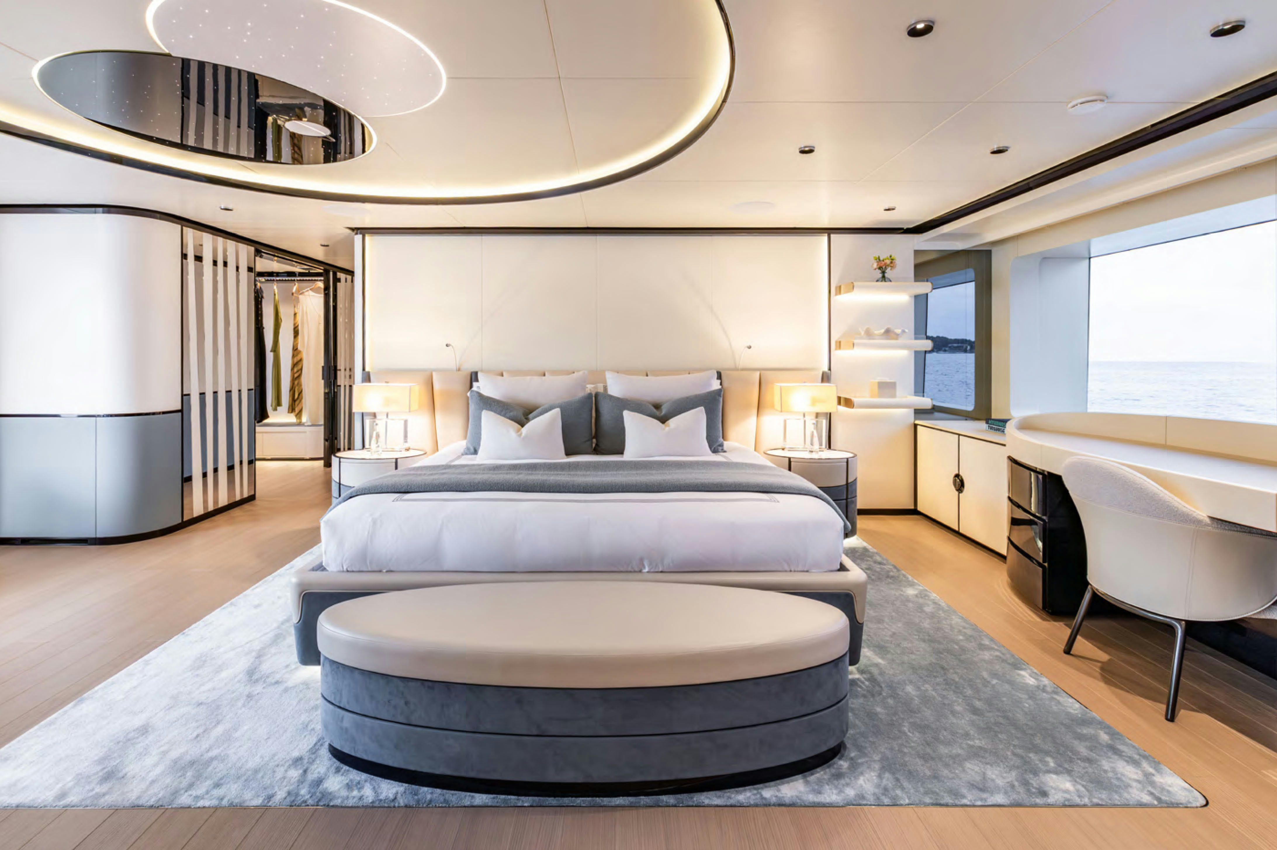 a large living room with a large bed and a large window aboard FELICITA Yacht for Charter