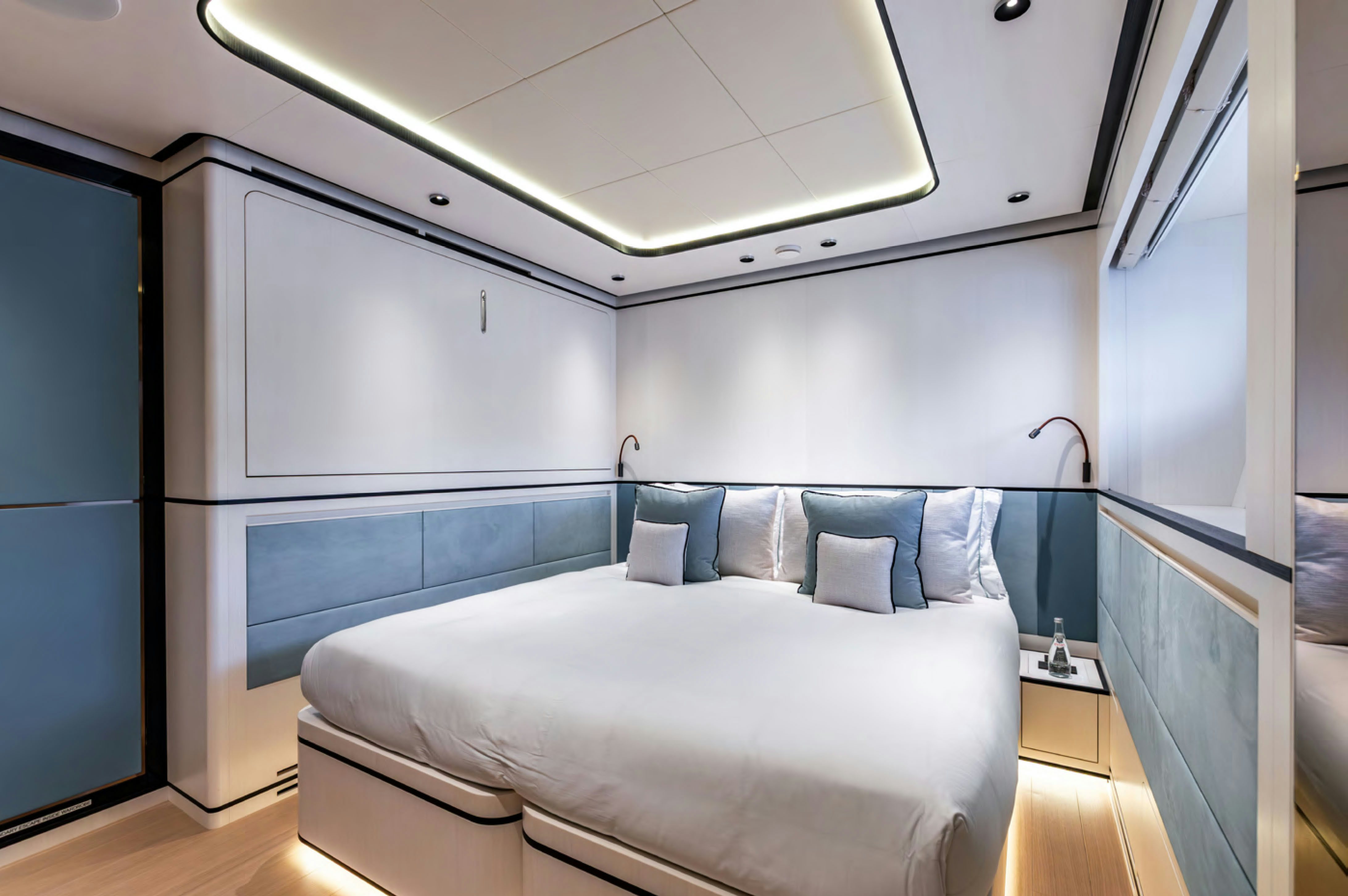 a room with a bed and a desk aboard FELICITA Yacht for Charter