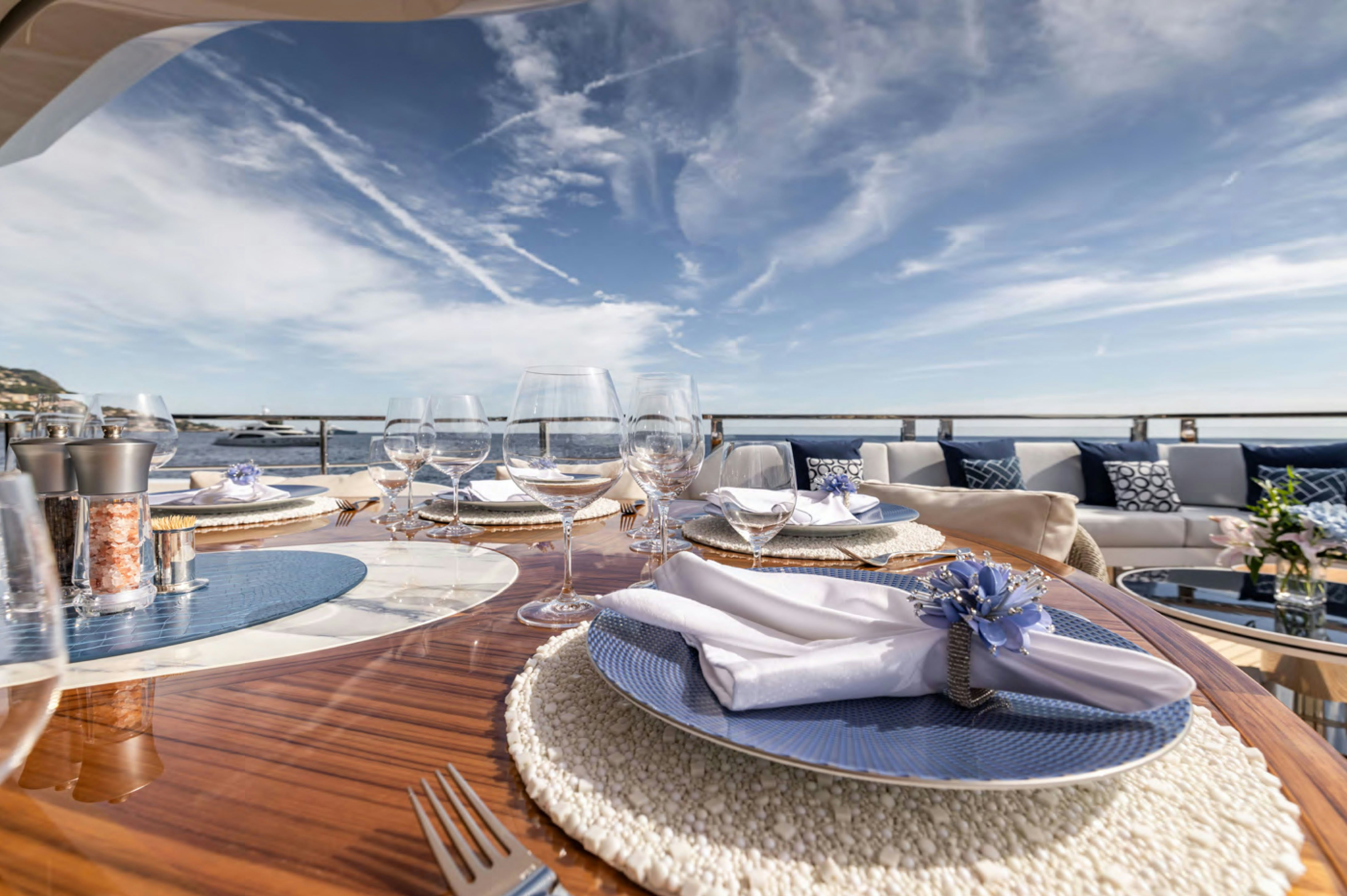 a large room with a table and chairs and a large window aboard FELICITA Yacht for Charter