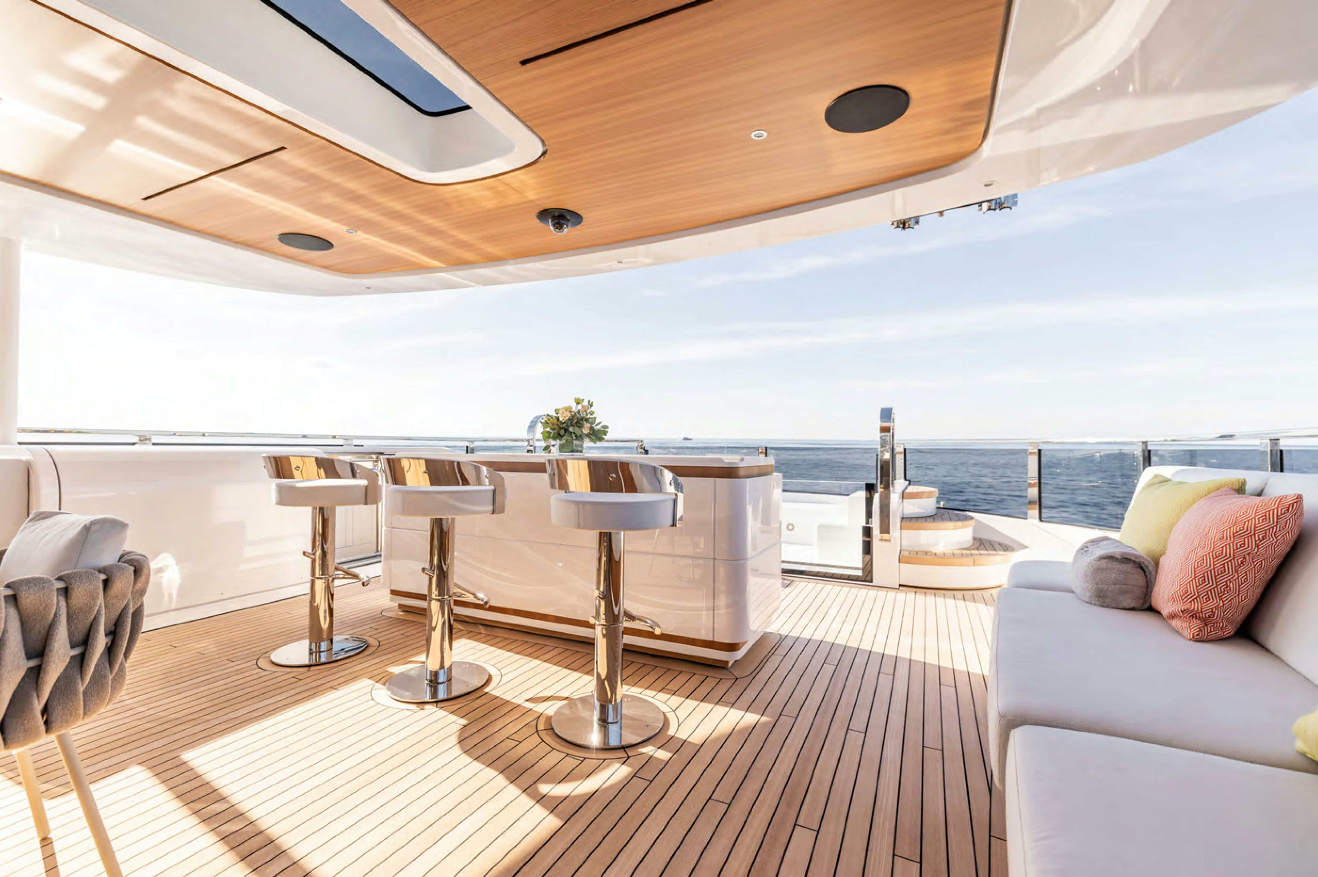 a large living room with a large balcony overlooking the ocean aboard FELICITA Yacht for Charter