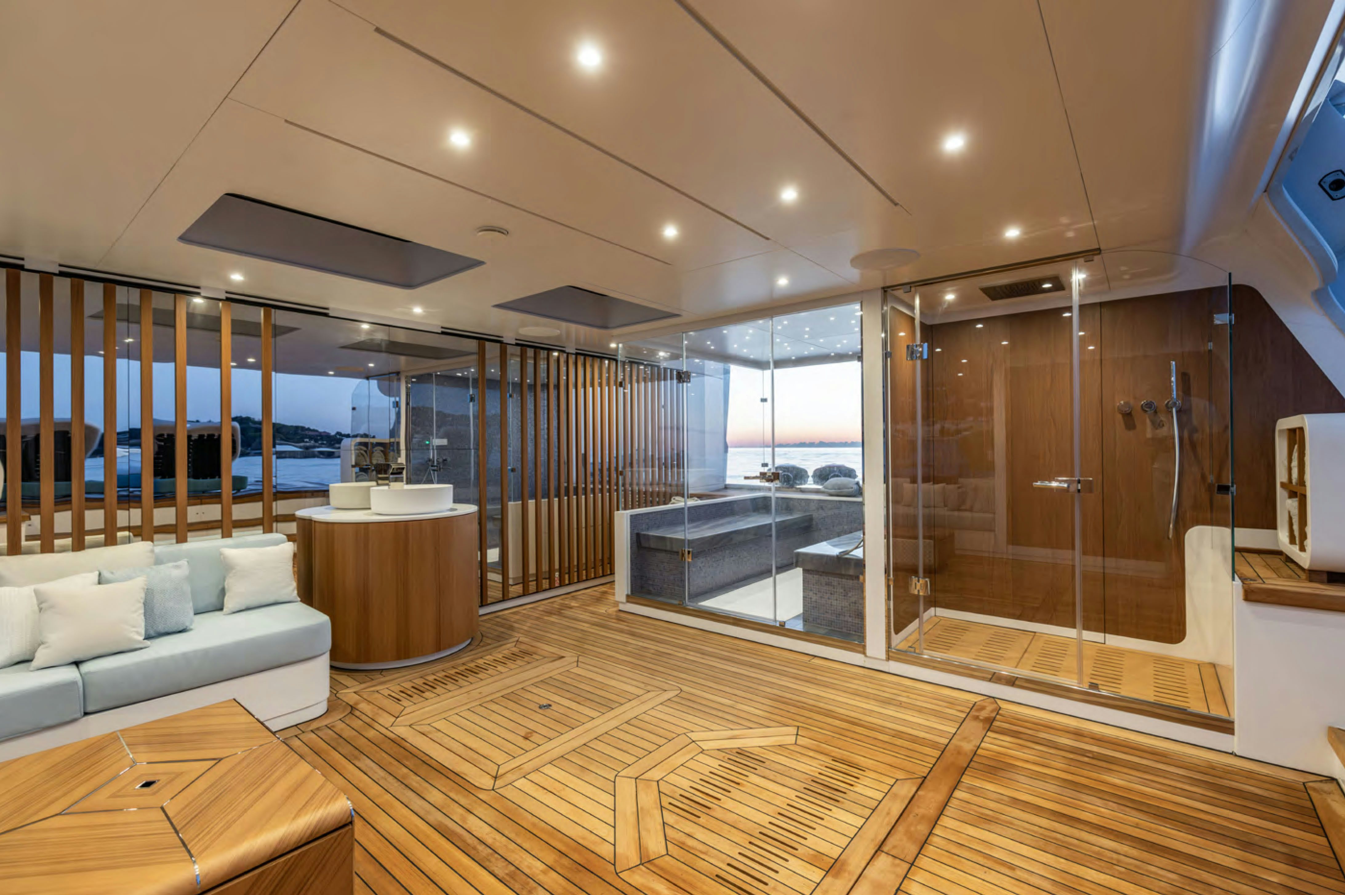 a room with a wood floor and a large glass door aboard FELICITA Yacht for Charter