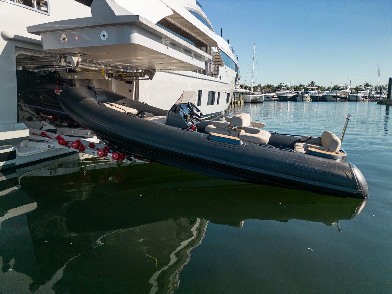 a boat docked at a pier aboard AMICO Yacht for Sale