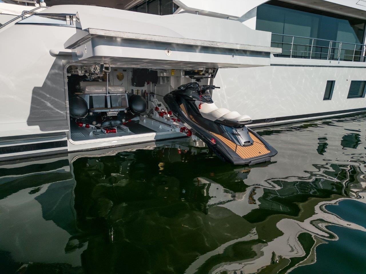 a boat with a motor on it aboard AMICO Yacht for Sale