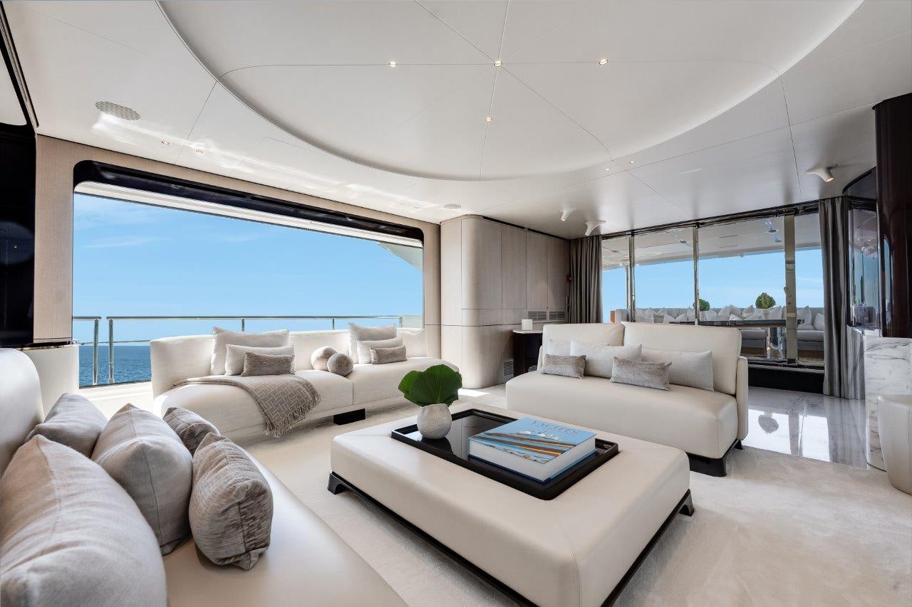 a living room with a large window aboard AMICO Yacht for Sale