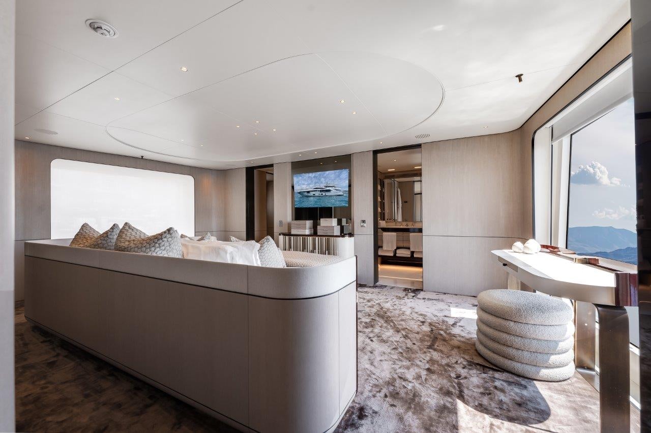 a large bedroom with a large bed aboard AMICO Yacht for Sale