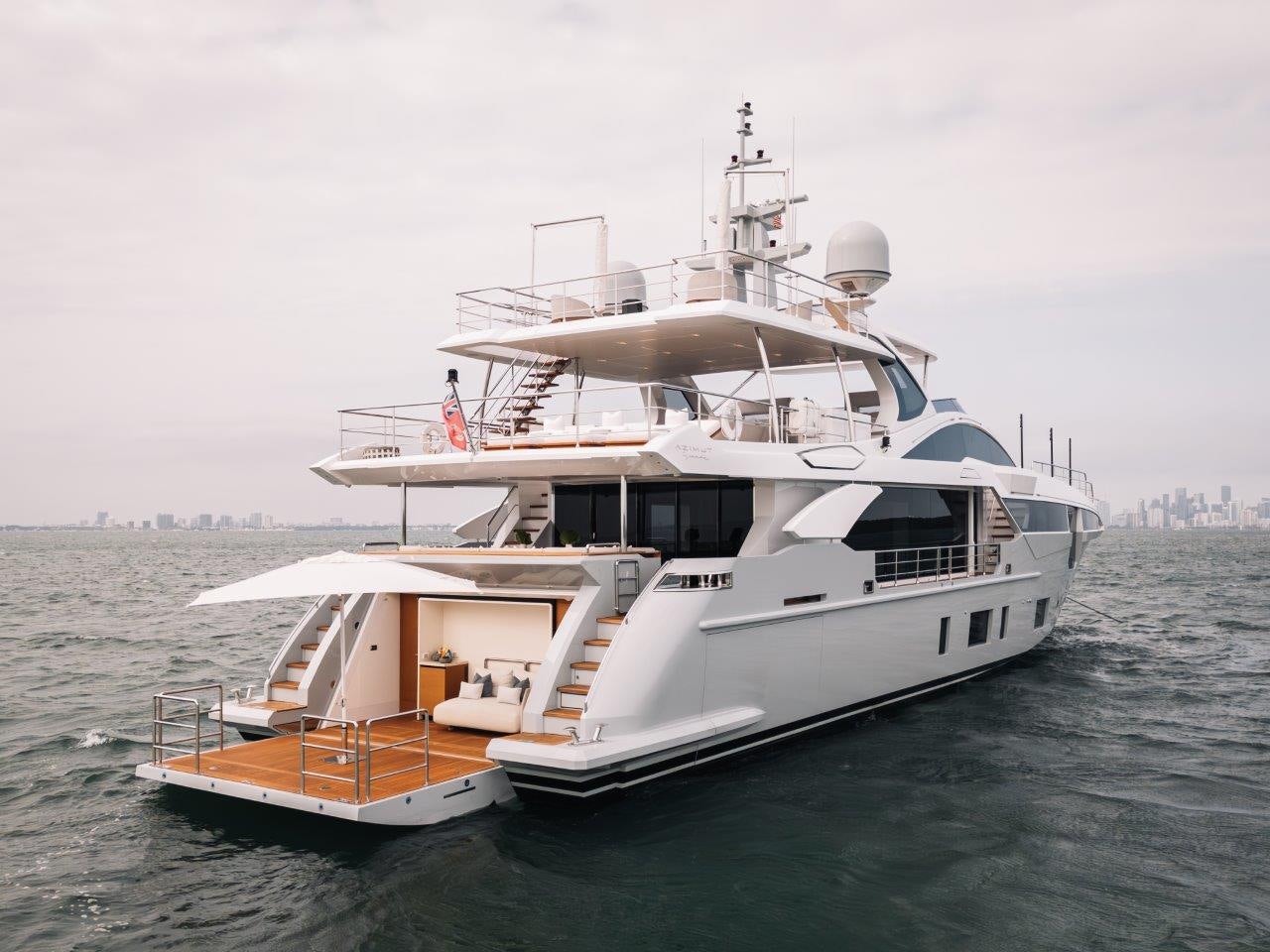 a large white boat in the water aboard AMICO Yacht for Sale