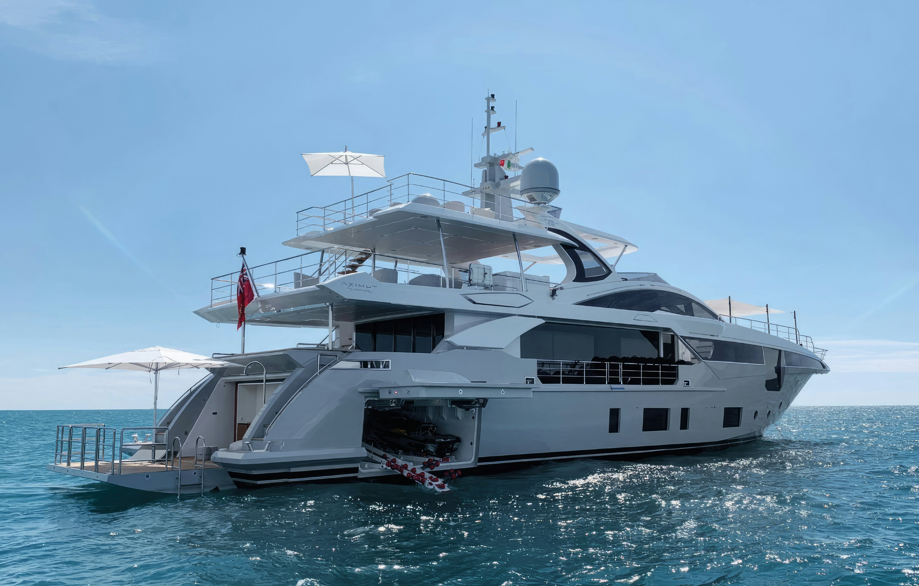 a large white boat in the water aboard AMICO Yacht for Sale