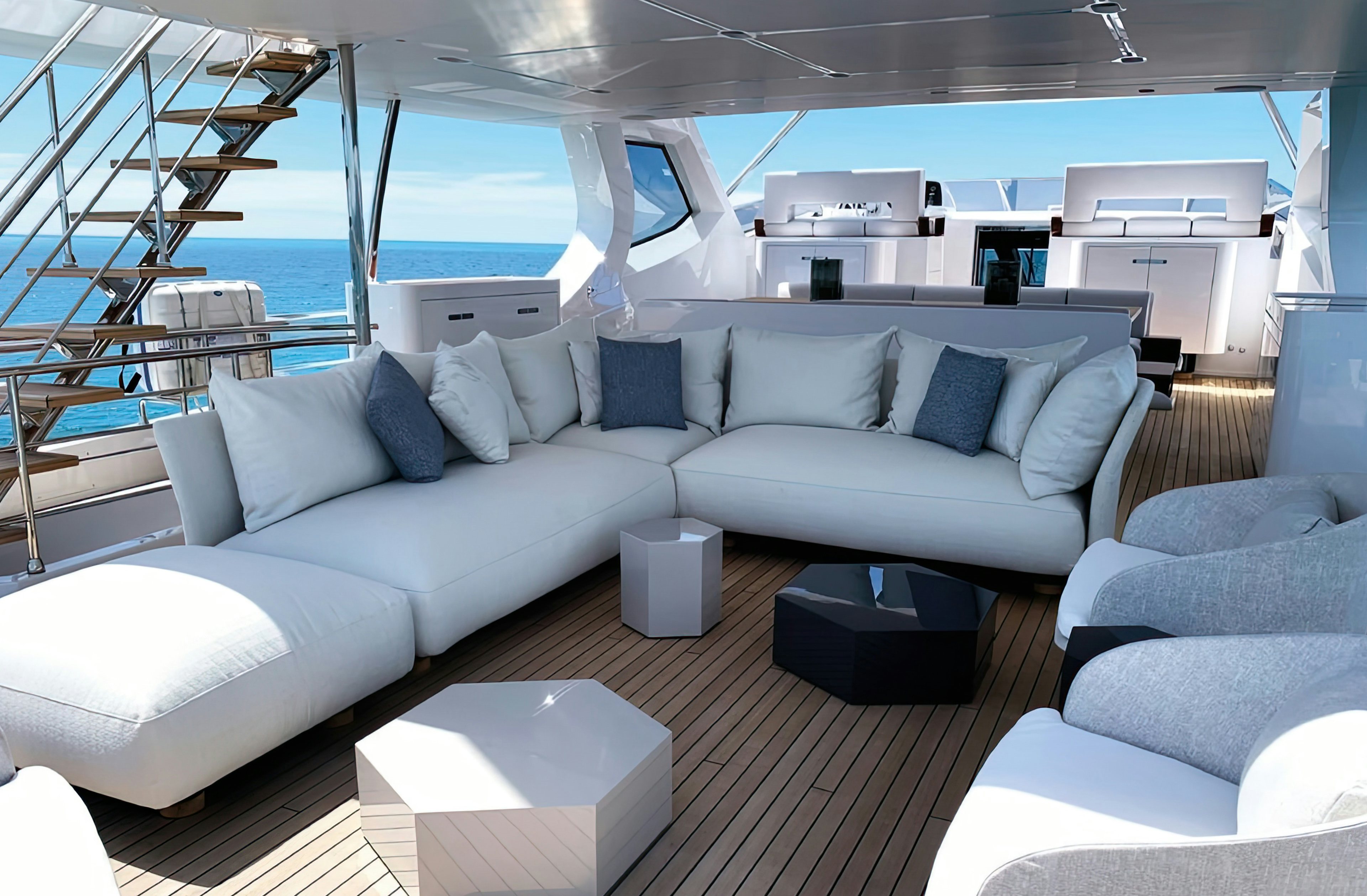 a room with a couch and a table aboard AMICO Yacht for Sale