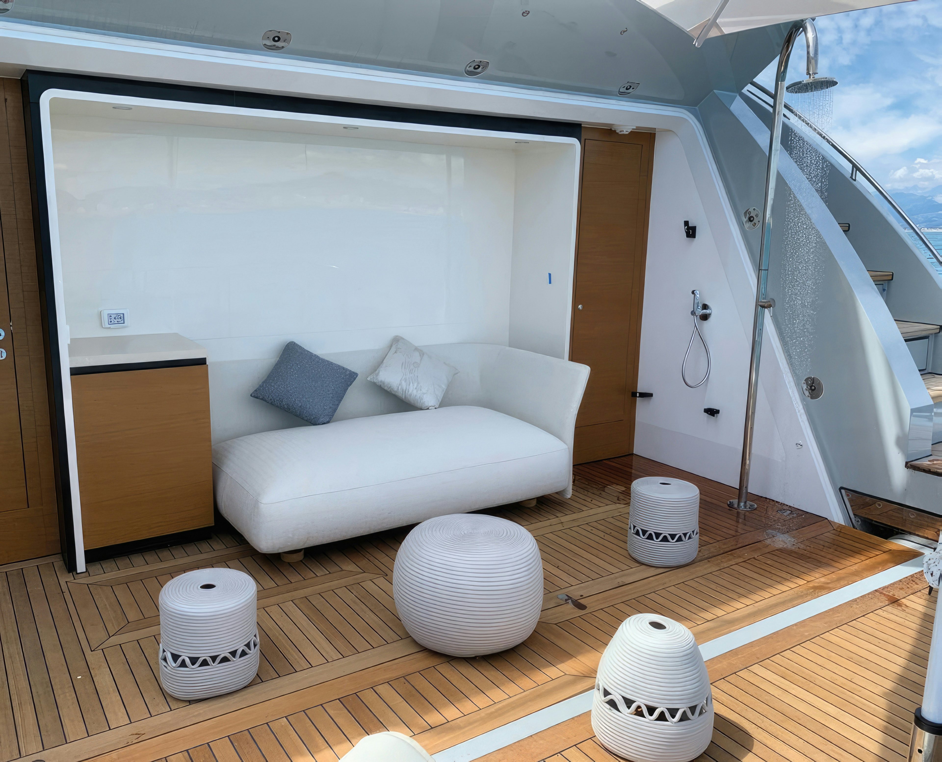a white couch in a room aboard AMICO Yacht for Sale