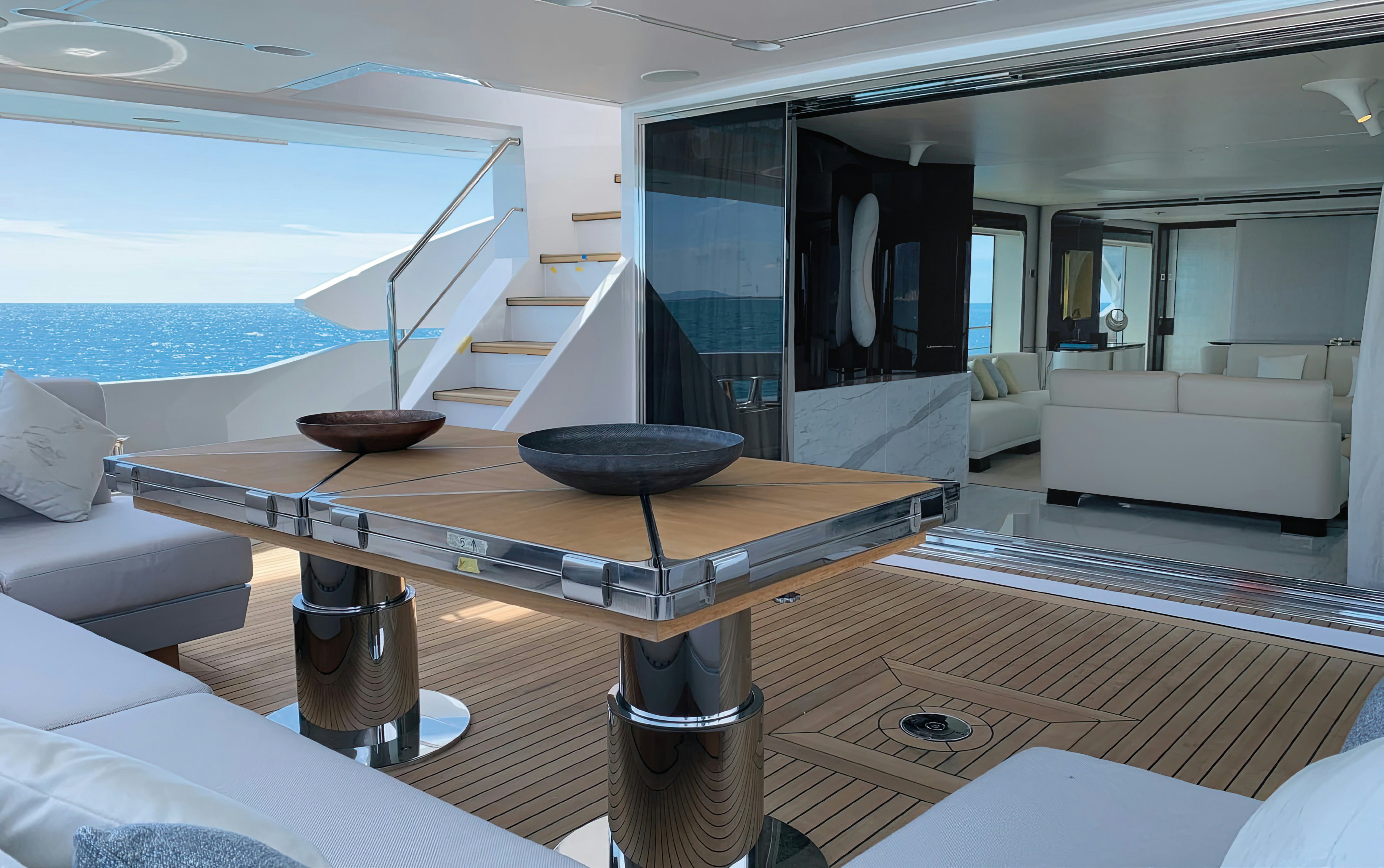 a table with a bowl on it aboard AMICO Yacht for Sale