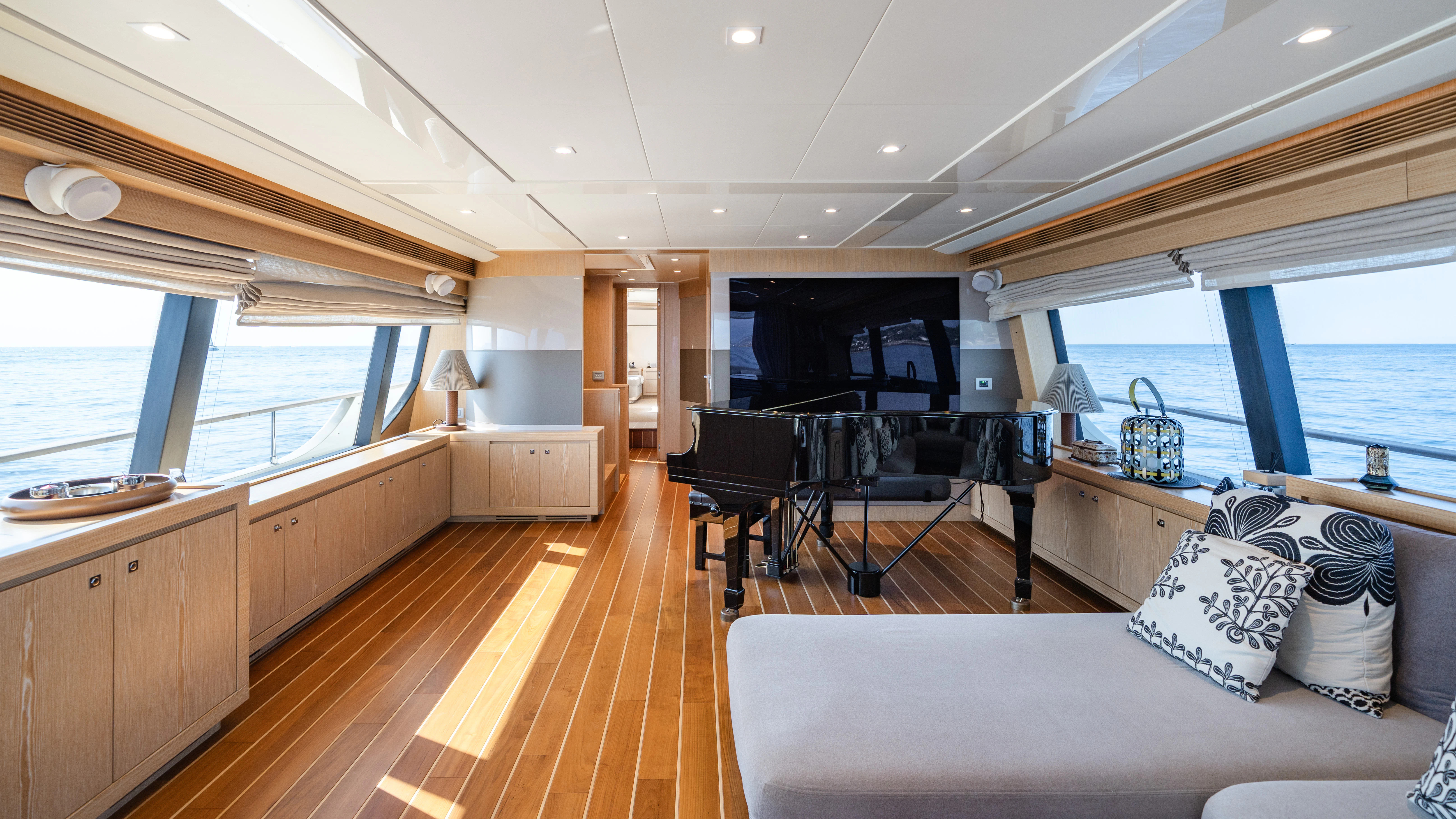 a large living room with a wood floor and a wood floor aboard GIADA Yacht for Sale