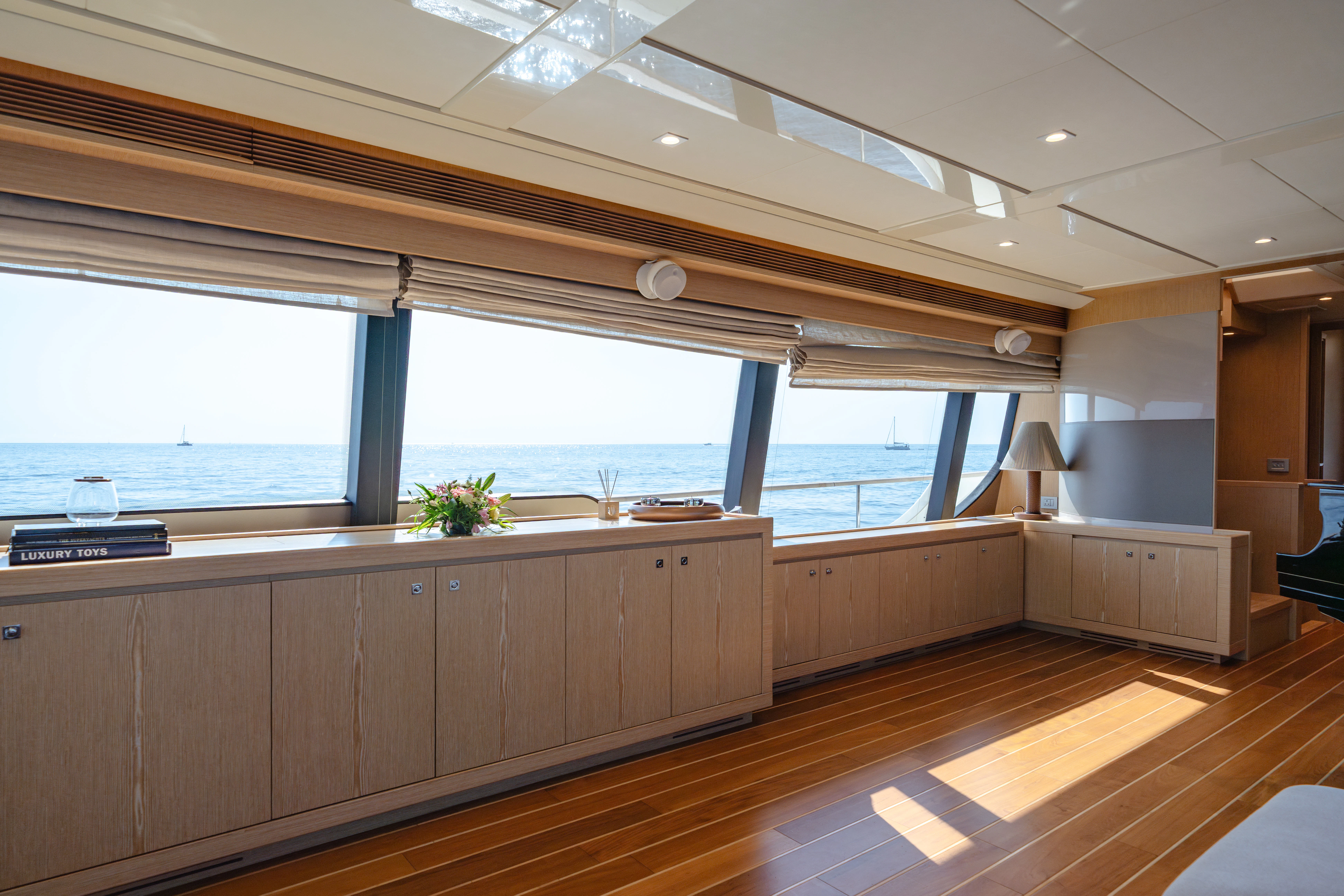 a large kitchen with a large window aboard GIADA Yacht for Sale