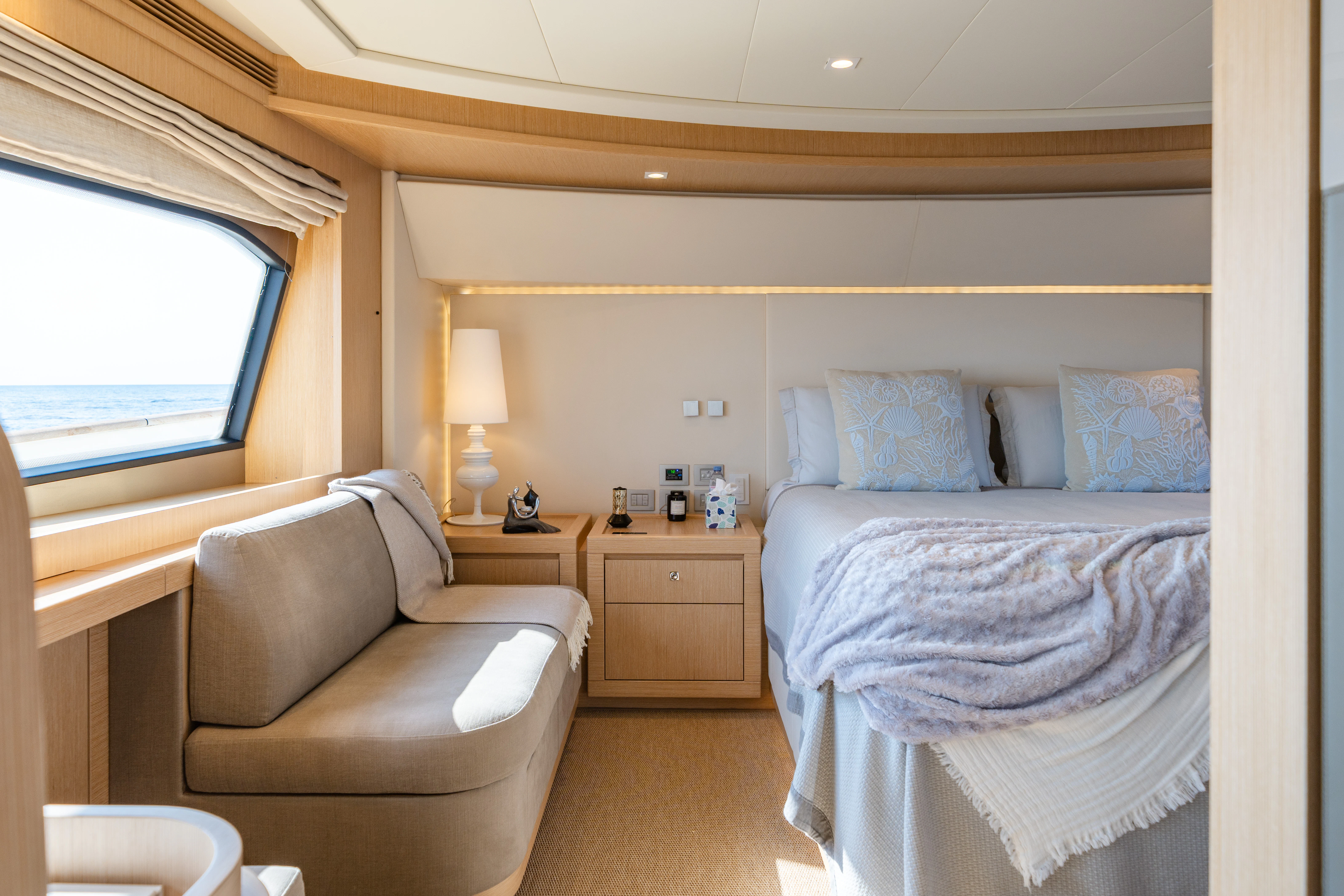 a bedroom with a bed and a couch aboard GIADA Yacht for Sale