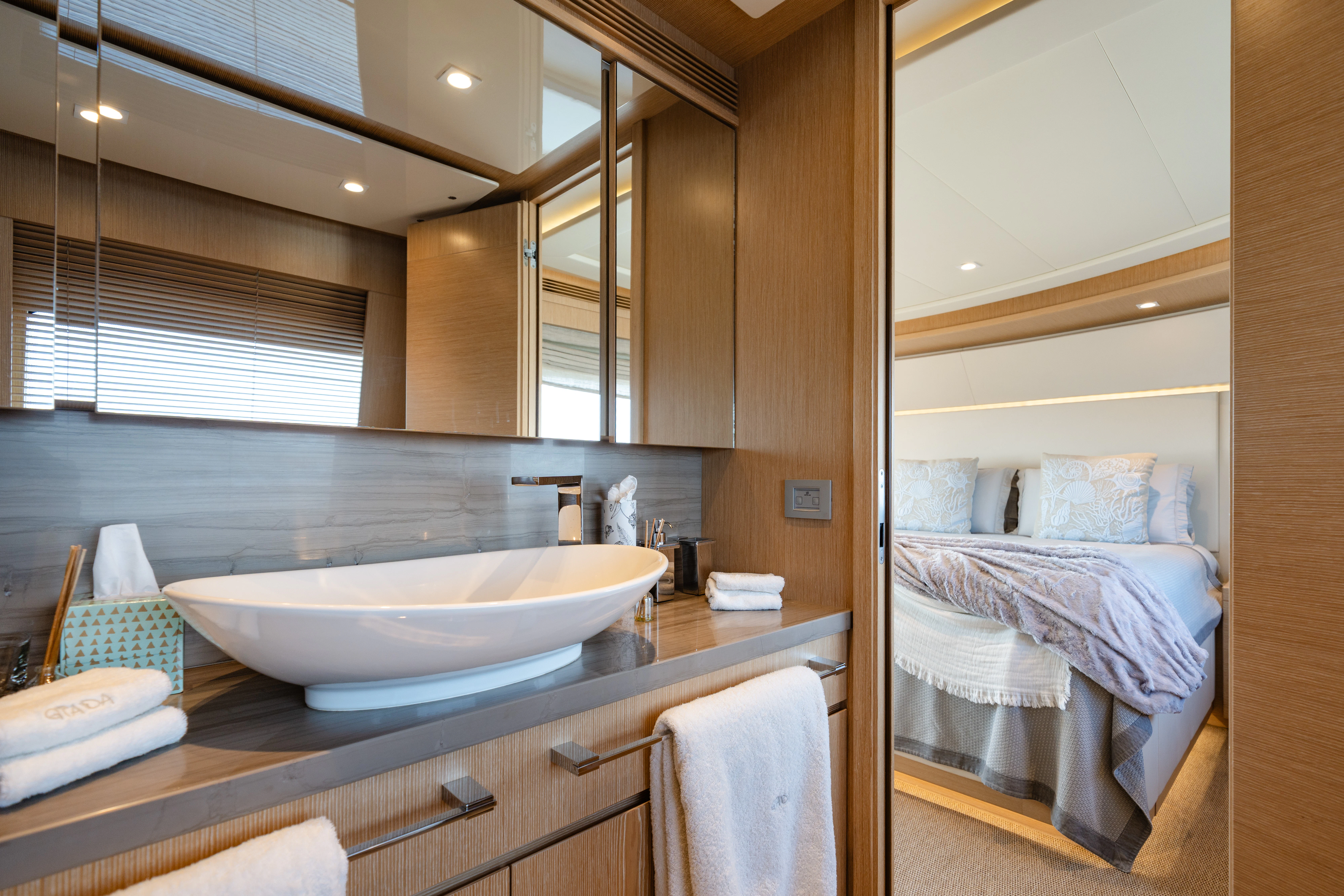 a bathroom with a sink and a bed aboard GIADA Yacht for Sale