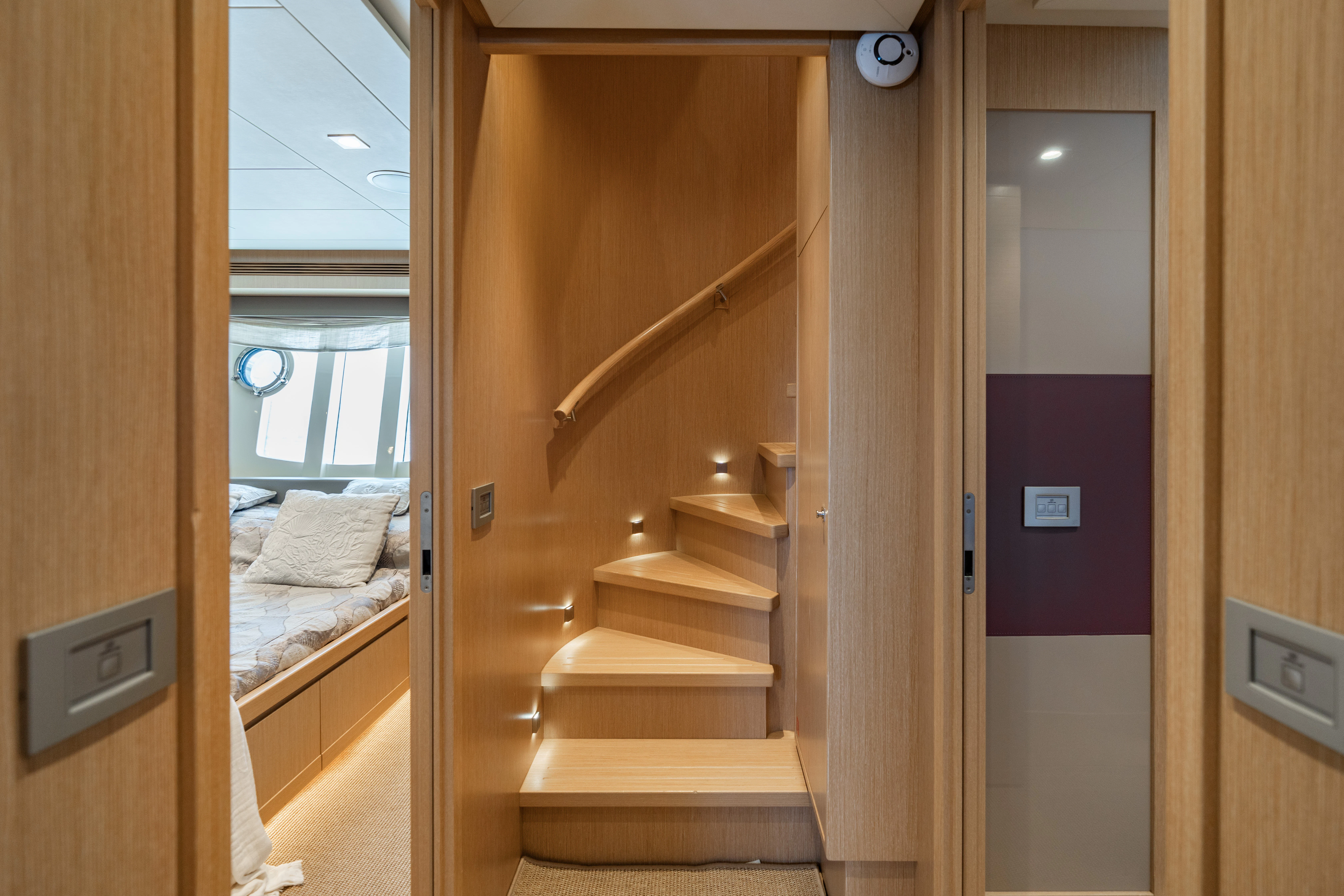 a room with a bed and a door aboard GIADA Yacht for Sale