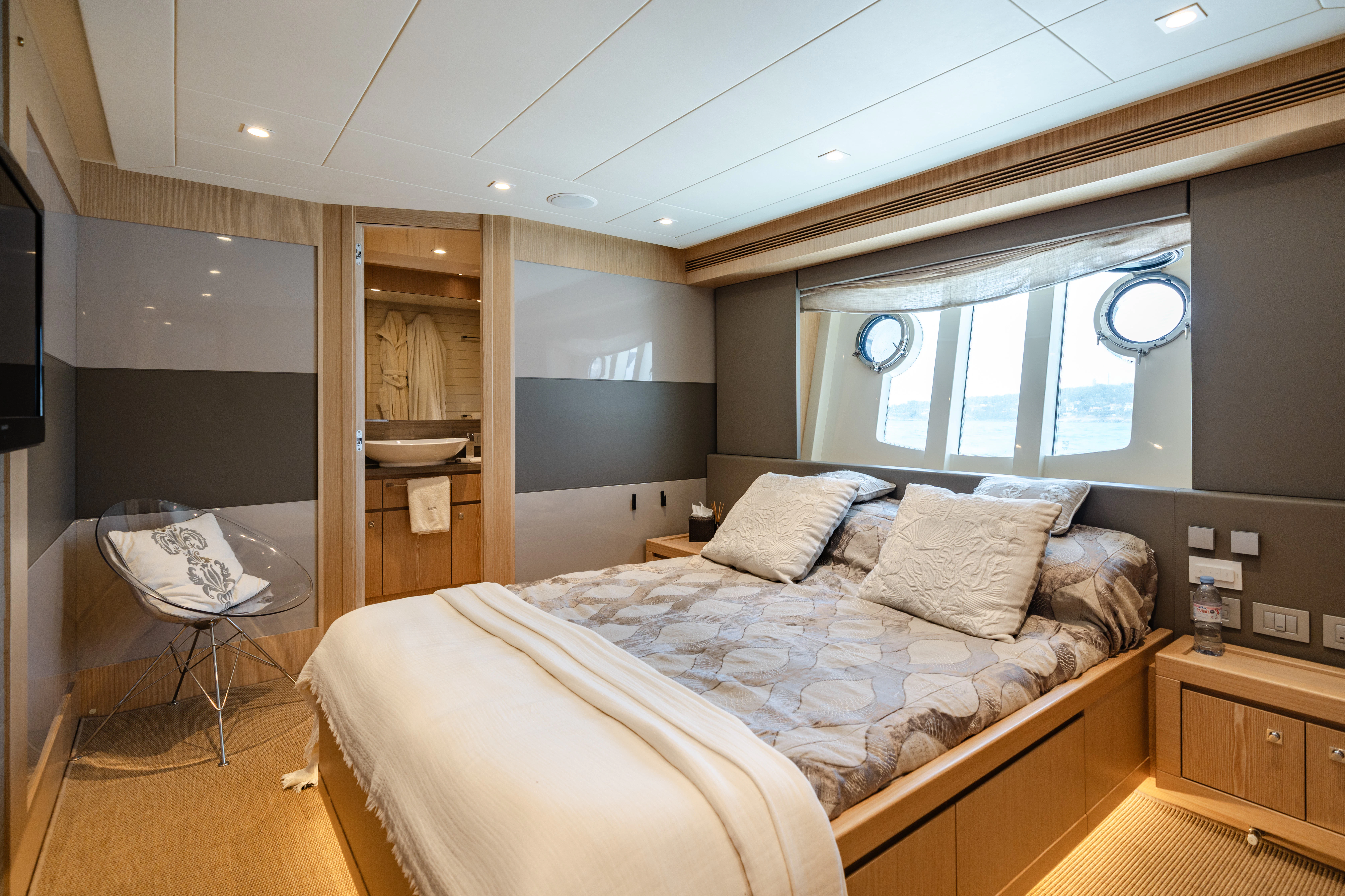 a bedroom with a bed and a table aboard GIADA Yacht for Sale
