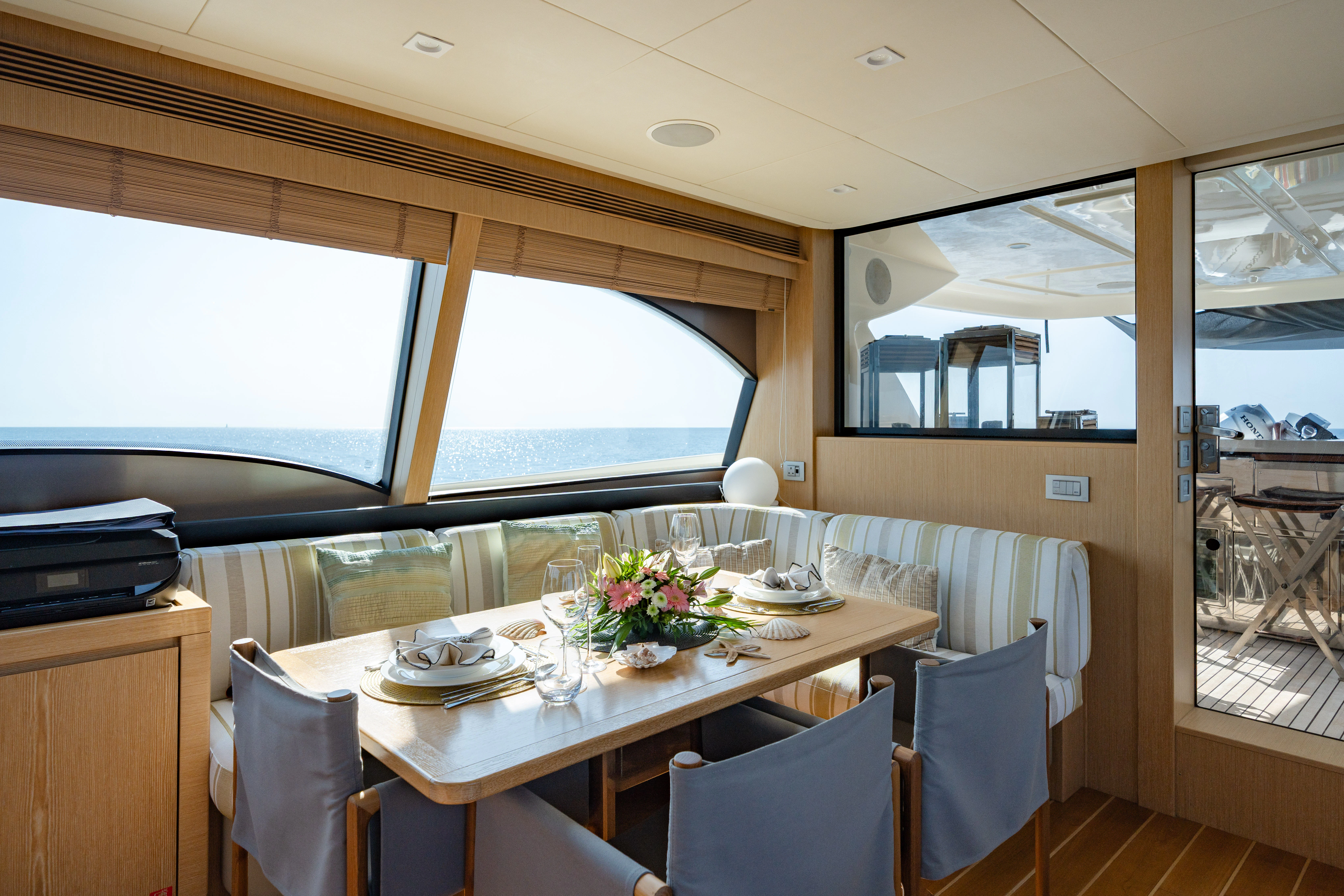 a dining table in a room aboard GIADA Yacht for Sale