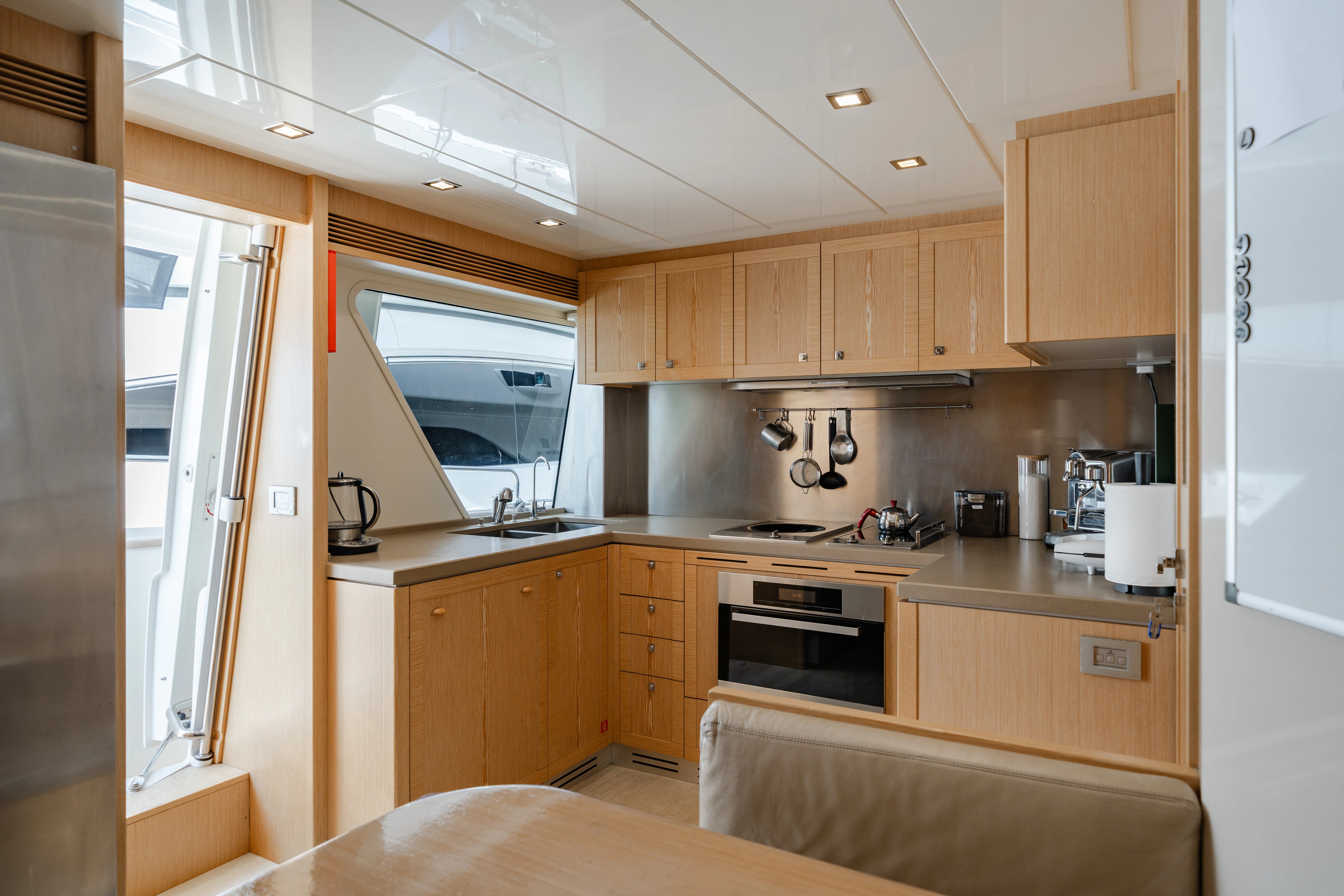 a kitchen with wooden cabinets aboard GIADA Yacht for Sale