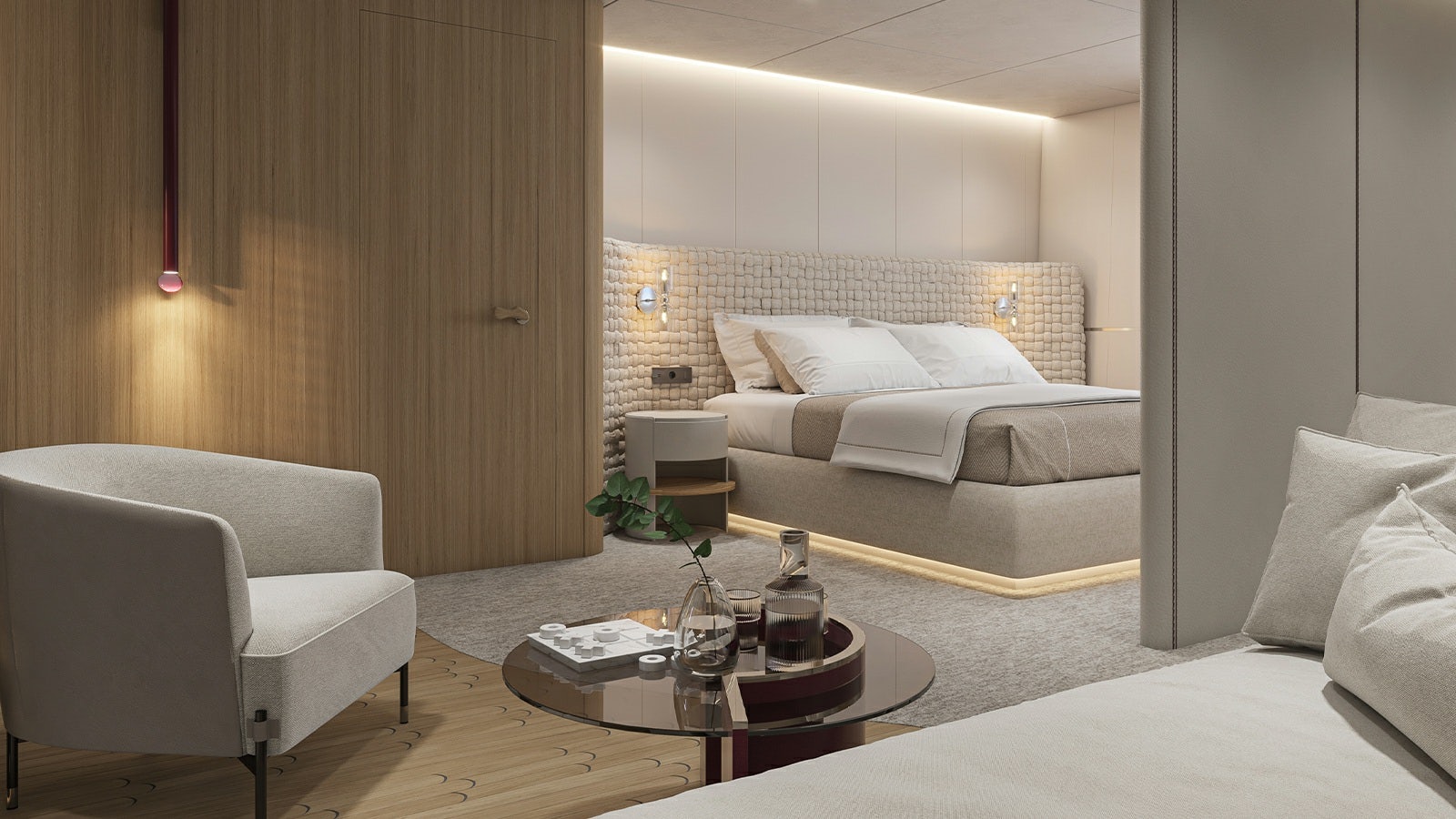 a room with a bed and a coffee table aboard REPOSADO Yacht for Charter