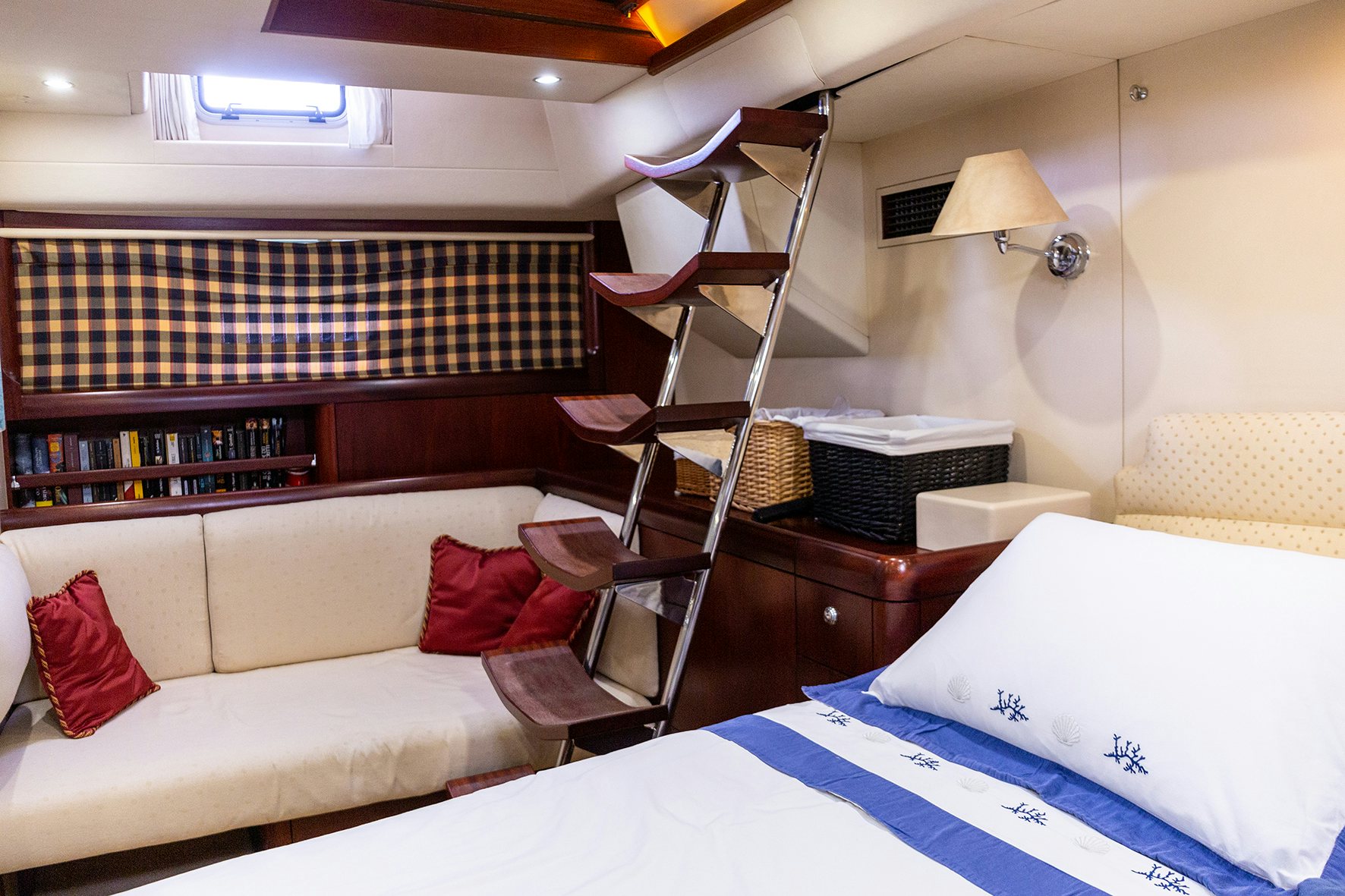 a room with a bed and a ladder aboard CYGNUS OF ANGLESEY Yacht for Sale