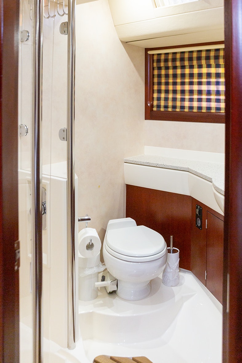 a bathroom with a toilet and a bathtub aboard CYGNUS OF ANGLESEY Yacht for Sale