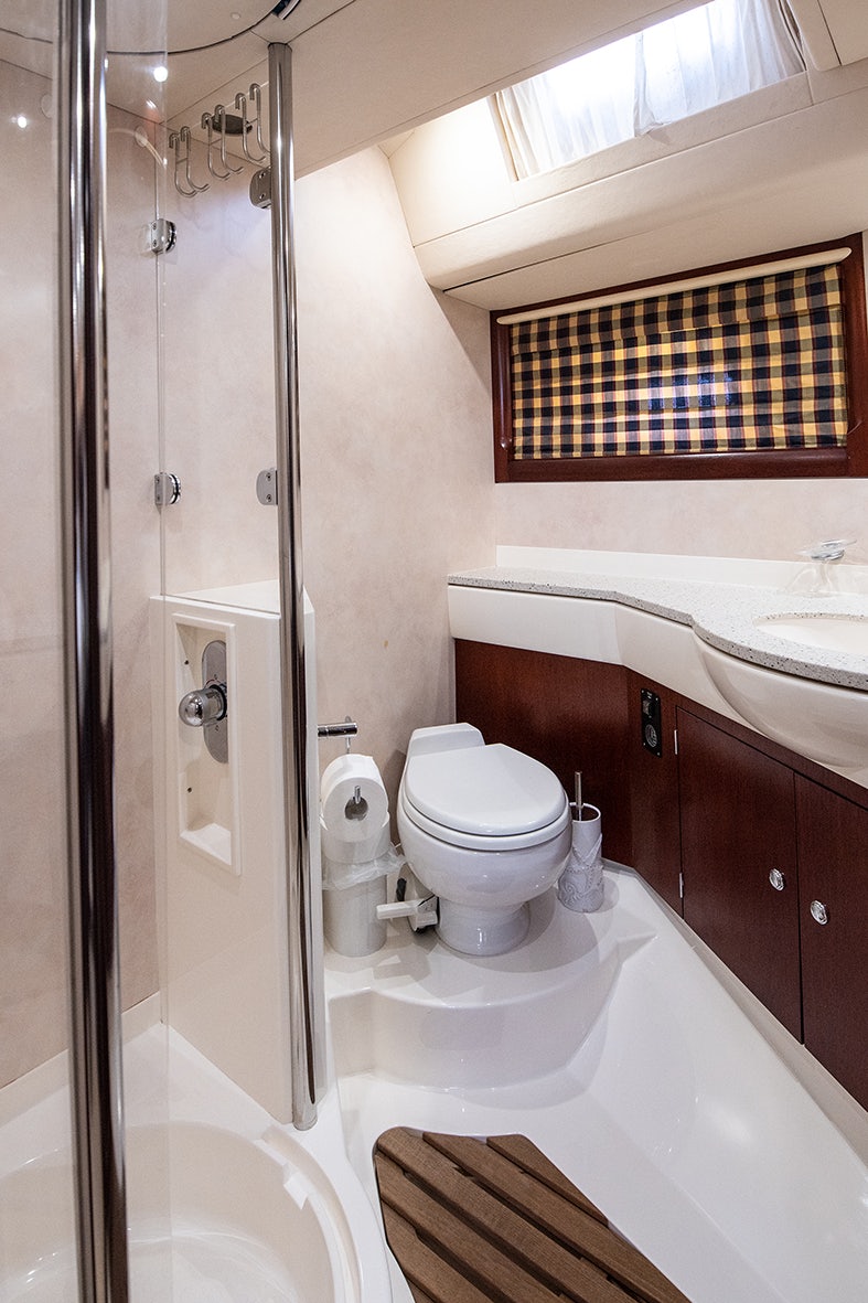 a bathroom with a shower and toilet aboard CYGNUS OF ANGLESEY Yacht for Sale