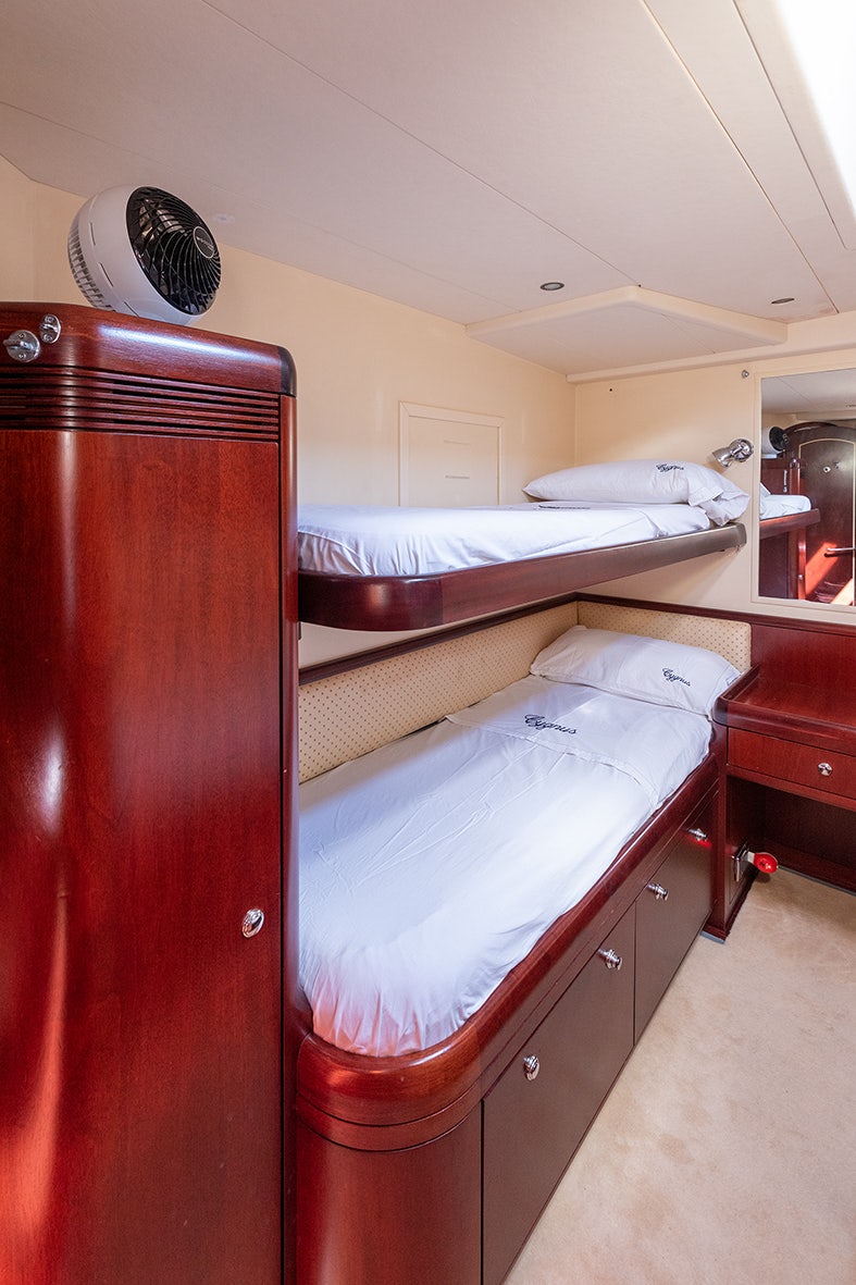 a room with a couple of beds aboard CYGNUS OF ANGLESEY Yacht for Sale