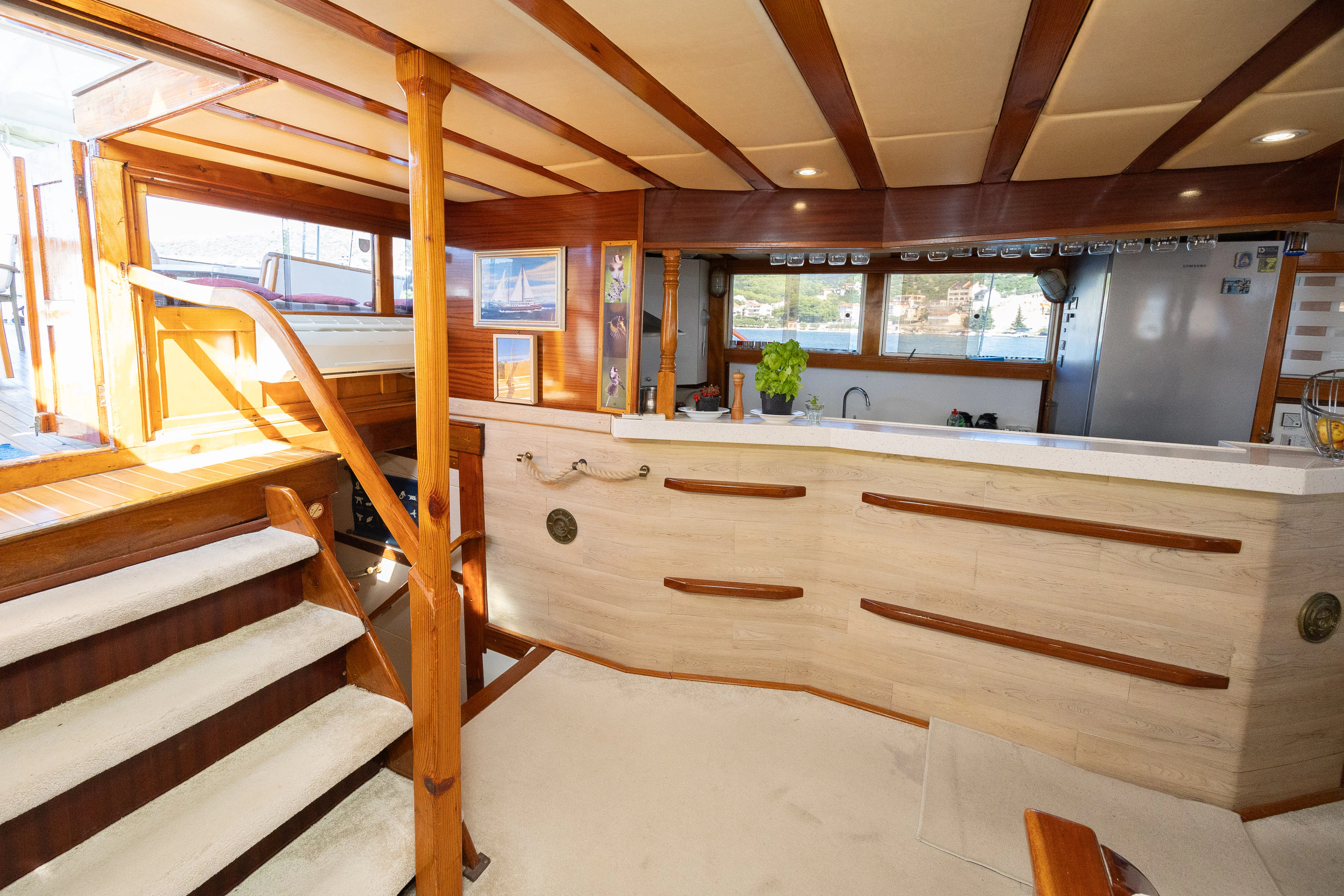a kitchen with wooden cabinets aboard GULET GARDELIN Yacht for Charter