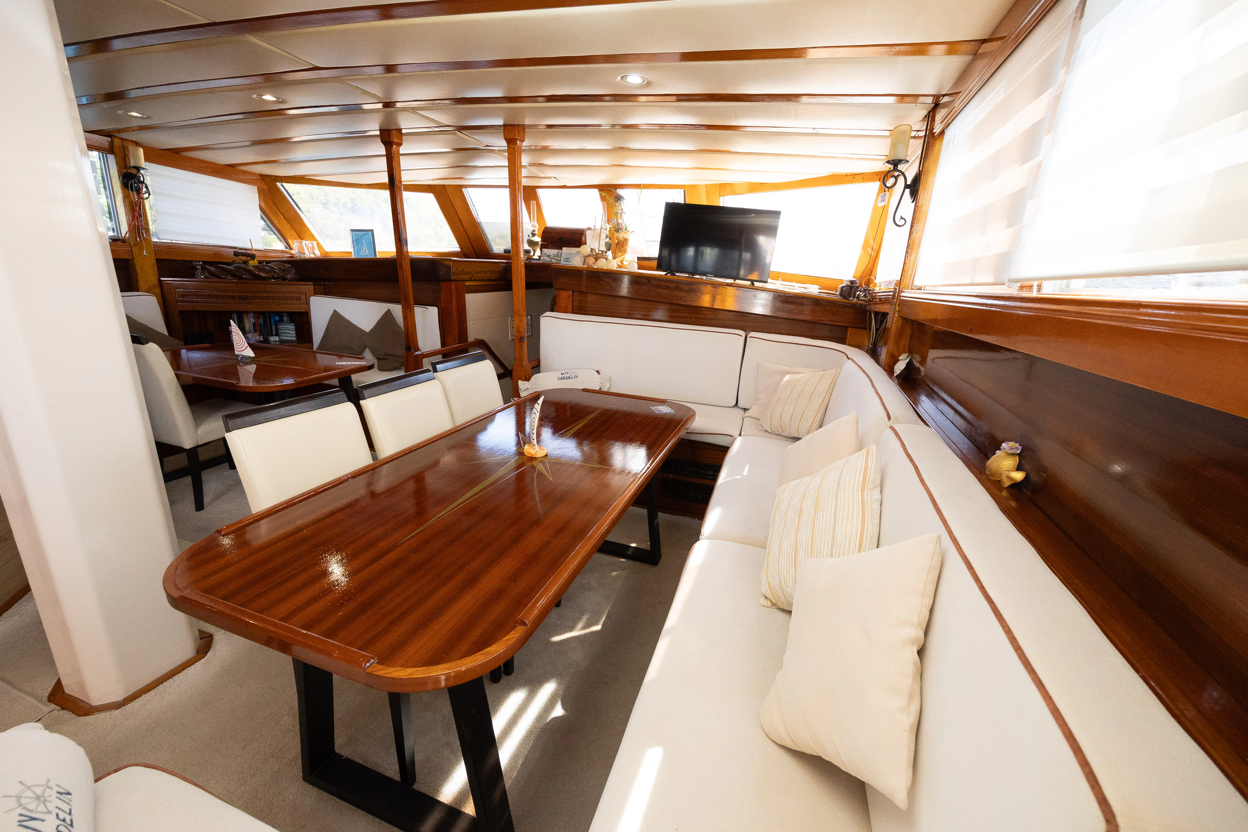 a room with a table and chairs aboard GULET GARDELIN Yacht for Charter