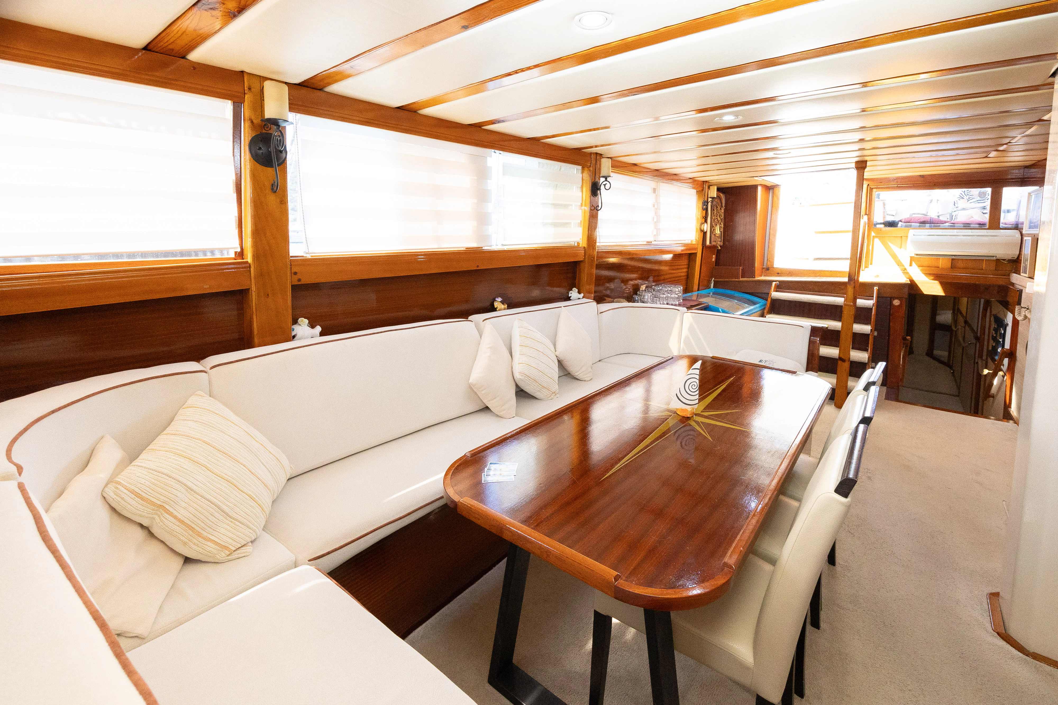 a room with a bed and a table aboard GULET GARDELIN Yacht for Charter