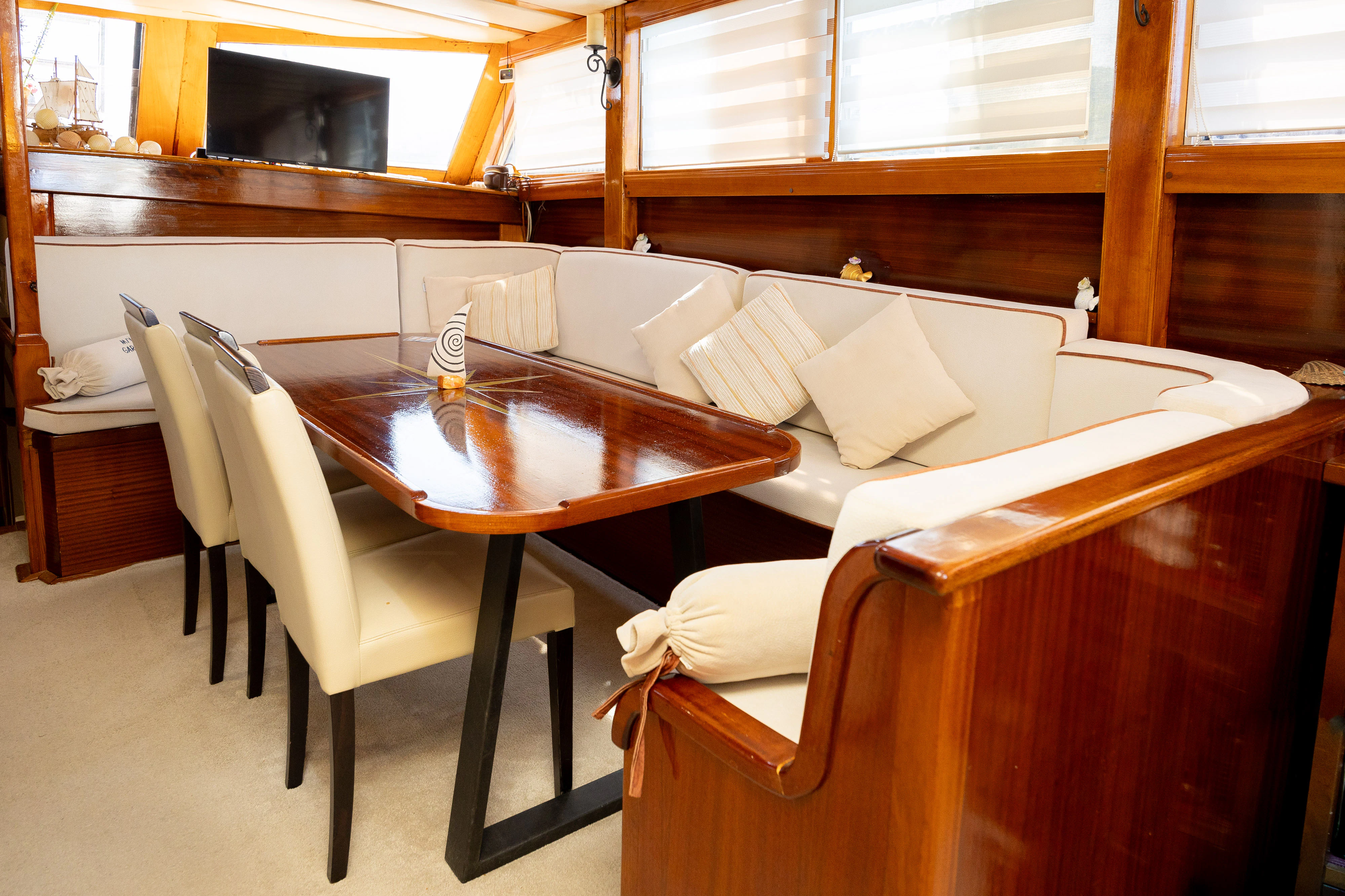 a room with a table and chairs aboard GULET GARDELIN Yacht for Charter