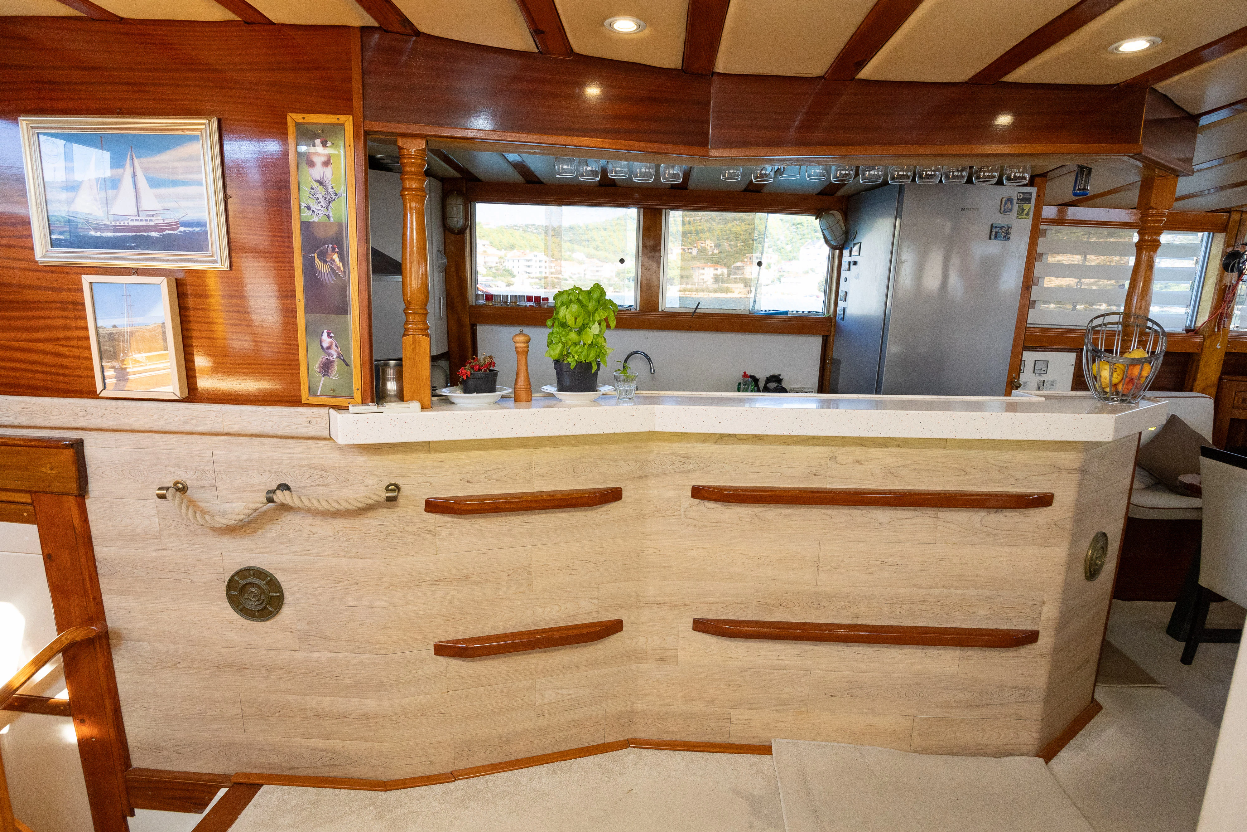 a kitchen with wooden cabinets aboard GULET GARDELIN Yacht for Charter