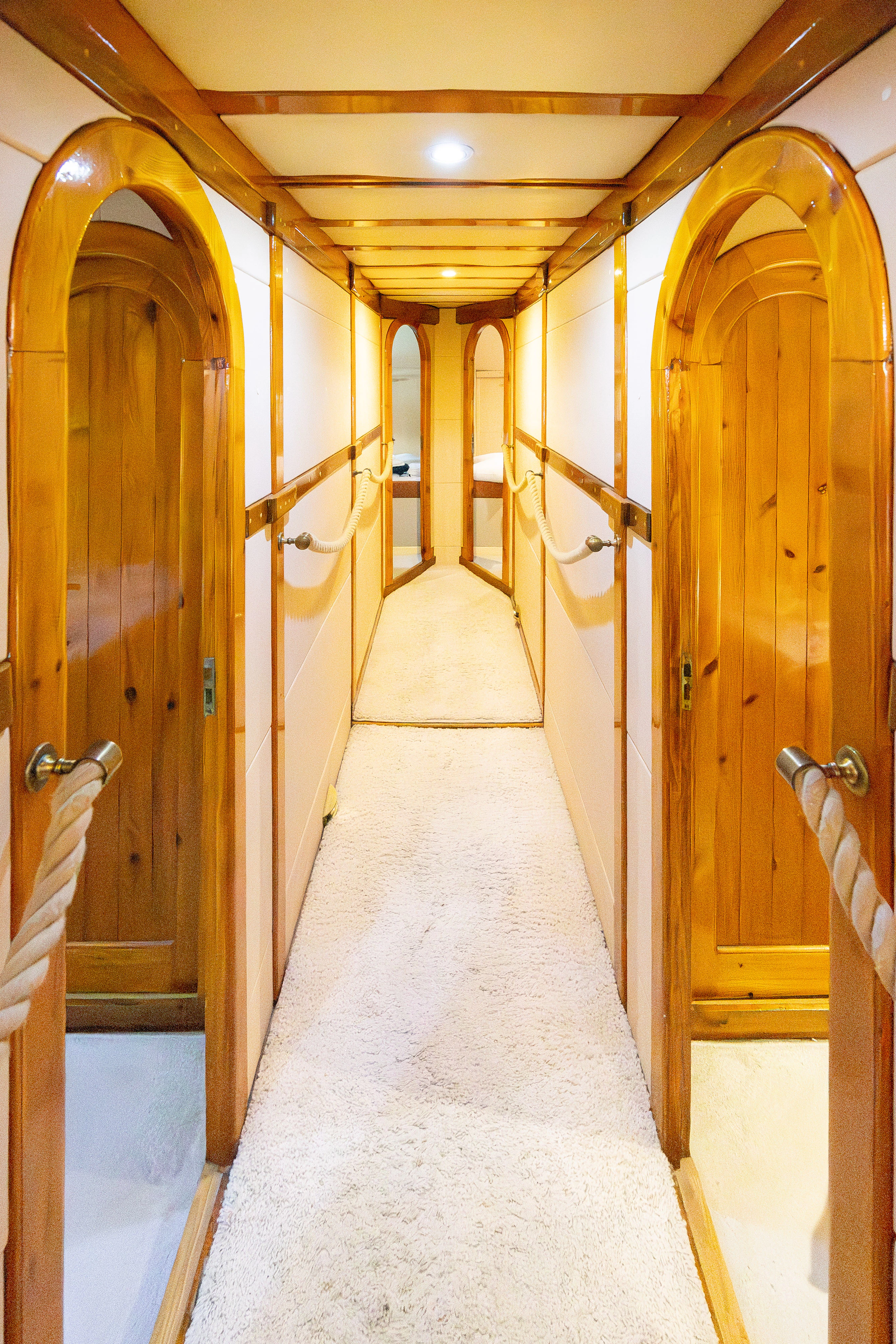 a hallway with doors aboard GULET GARDELIN Yacht for Charter