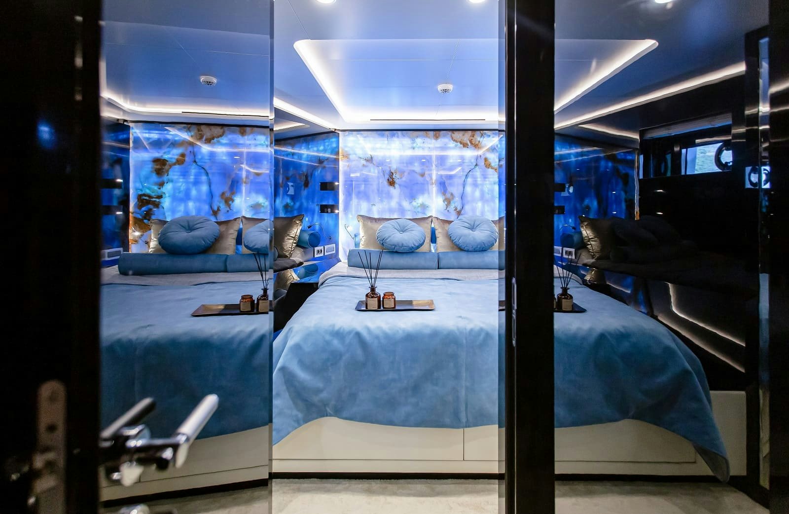 a room with a bed and a blue bed aboard LEVANNA Yacht for Sale