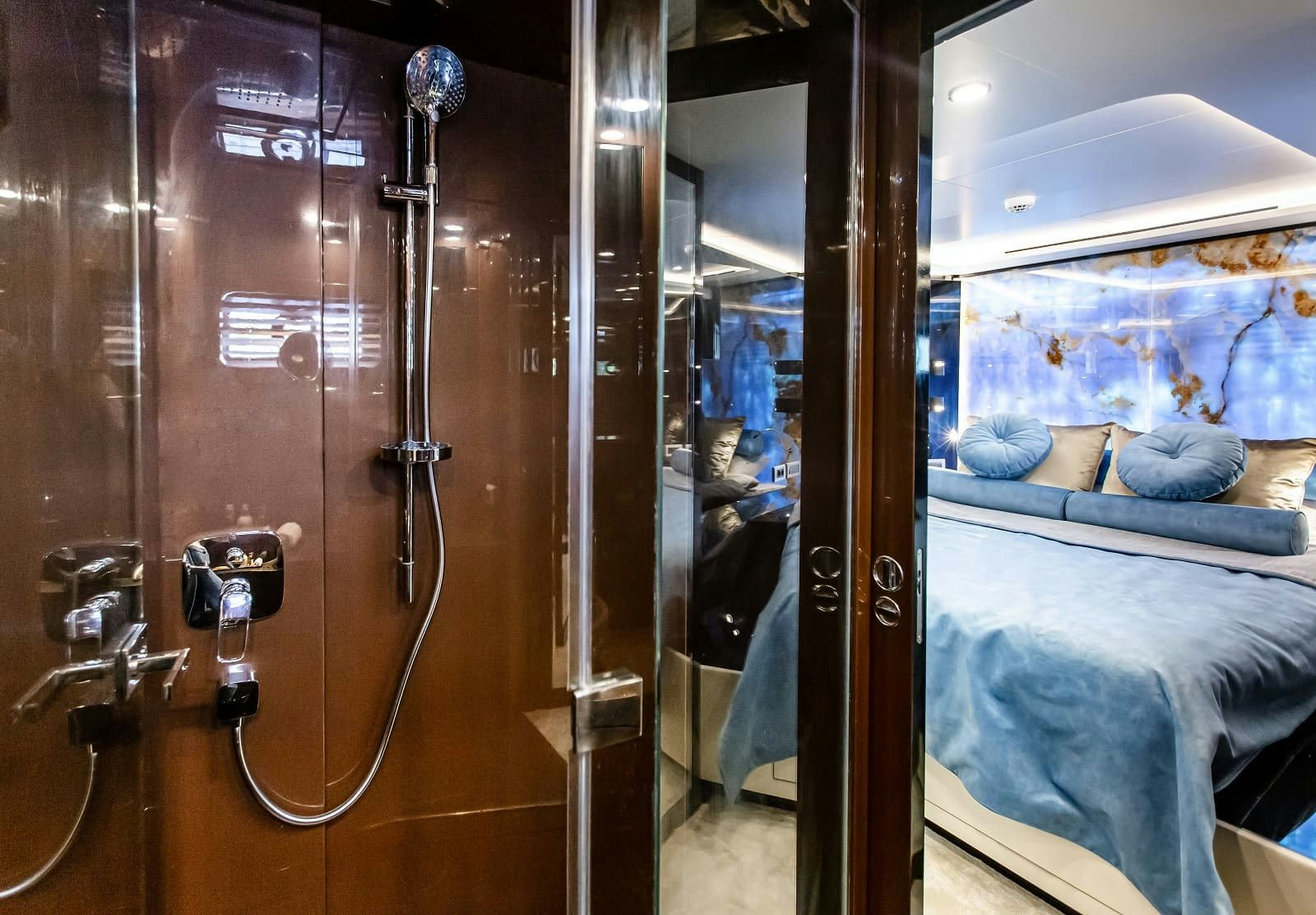 a glass case with a bed and a mirror aboard LEVANNA Yacht for Sale